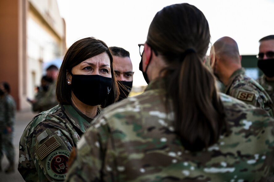 Chief Master Sgt. of the Air Force JoAnne S. Bass, speaks with Staff Sgt. Hannah Ziffer, 2nd Security Forces Squadron pass and registration non-commissioned officer, during a tour of Barksdale Air Force Base, Louisiana, April 21, 2021. During the tour, Bass spent time speaking one on one with Airmen of the 2nd Bomb Wing to receive feedback and answer questions about the future of the Air Force. (U.S. Air Force photo by Senior Airman Christina Graves)