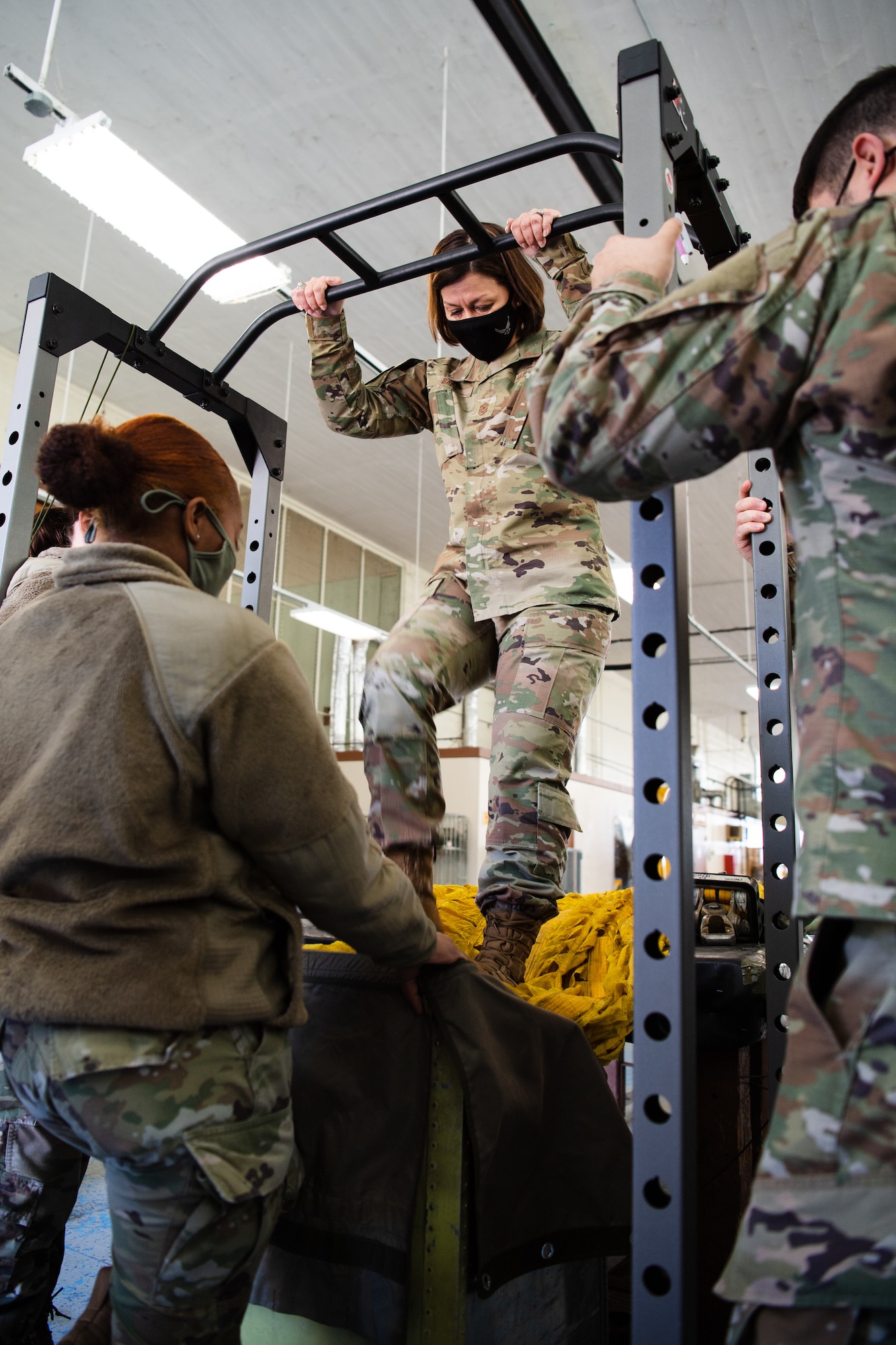 Chief Master Sgt. of the Air Force JoAnne S. Bass packs a B-52H Stratofortress parachute during her visit to Barksdale Air Force Base, Louisiana, April 22, 2021. During the tour, Bass familiarized herself with the mission of the 2nd Bomb Wing. (U.S. Air Force photo by Airman 1st Class Jacob B. Wrightsman)