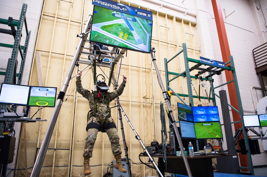 Chief Master Sgt. of the Air Force JoAnne S. Bass uses the 2nd Operational Support Squadron parachute simulator during her visit to Barksdale Air Force Base, Louisiana, April 22, 2021. Bass spent time with Airmen from across the installation, learning about their role in the mission of providing the nation with global strike capabilities. (U.S. Air Force photo by Airman 1st Class Jacob B. Wrightsman)