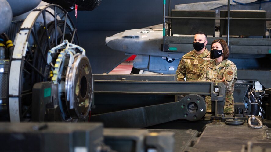 Chief Master Sgt. of the Air Force JoAnne S. Bass gets a tour of the 2nd Munitions Squadron weapons capabilities during her tour at Barksdale Air Force Base, Louisiana, April 22, 2021. Bass spent her time at Barksdale visiting Airmen and getting familiar with their role in providing the nation with global bomber capabilities. (U.S. Air Force photo by Airman 1st Class Jacob B. Wrightsman)