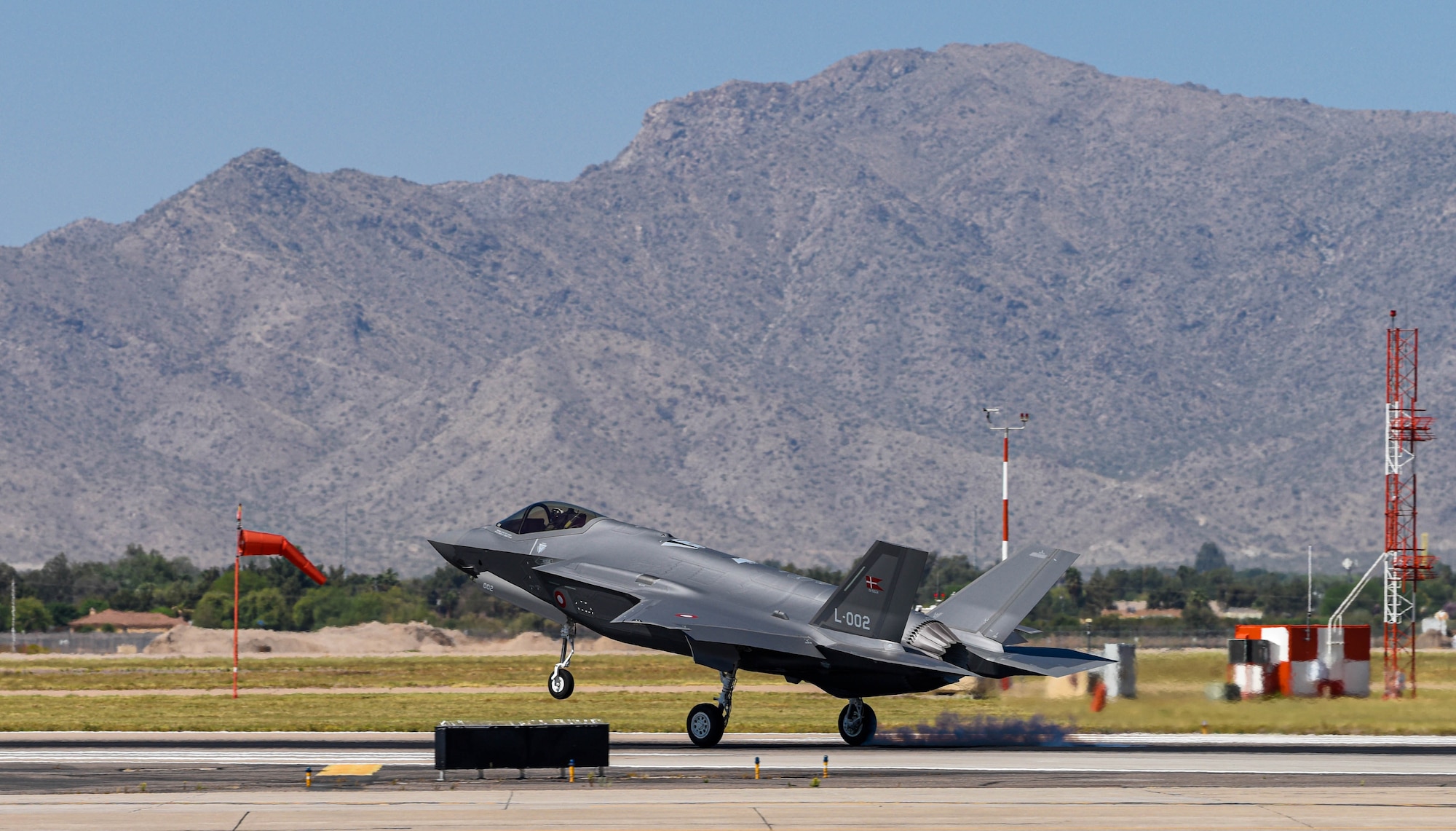 A Royal Danish Air Force F-35A Lightning II assigned to the 308th Fighter Squadron lands, April 13, 2021, at Luke Air Force Base, Arizona.