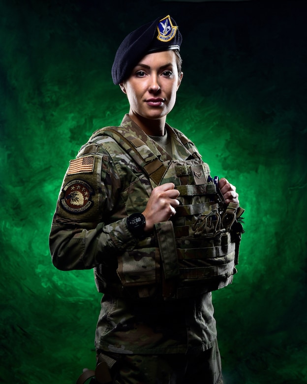 Airman 1st Class Leslie Ann Lindsay displays some of her 50th Security Forces Squadron gear during a shoot March 22, 2021 at Schriever Air Force Base, Colorado. After a stint with the NFL's Indianapolis Colts and the NBA's Indiana Pacers, Lindsay joined the Air Force and is currently with the 50th Security Forces Squadron. (Photo by Dennis Rogers)