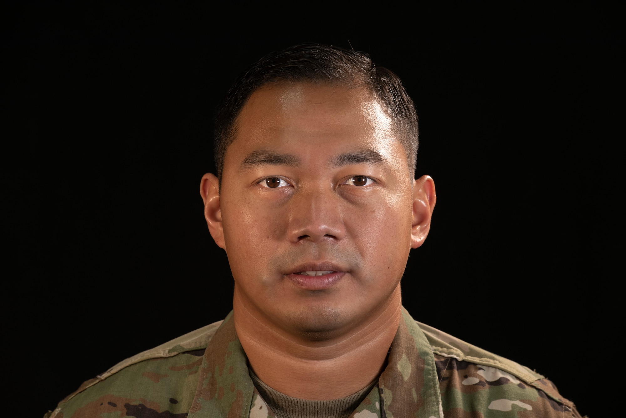 Tech. Sgt. Leo Mangahas, 664th Combat Communication Squadron NCO in charge of quality assurance, poses for a photo at Andersen Air Force Base, Guam, March 16, 2021.