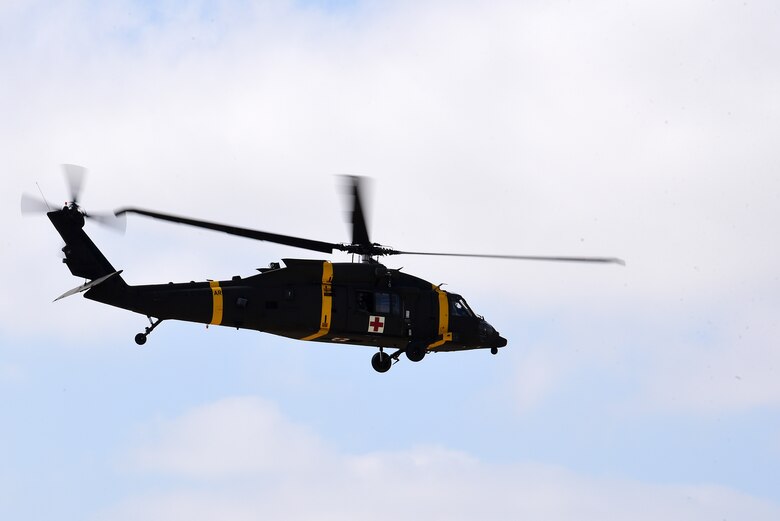 A U.S. Army HH-60M Black Hawk helicopter hovers over the flightline during a joint medical evacuation training exercise at Kunsan Air Base, Republic of Korea, April 13, 2021. Military working dog teams from the 8th Security Forces Squadron participated in the first joint medevac training exercise with the units from Camp Humphreys, to observe and calculate the steps needed to properly execute a medevac for MWDs and their handlers as well as reevaluate and develop processes for continuity and quick action responses in these kinds of scenarios. (U.S. Air Force photo by Senior Airman Suzie Plotnikov)