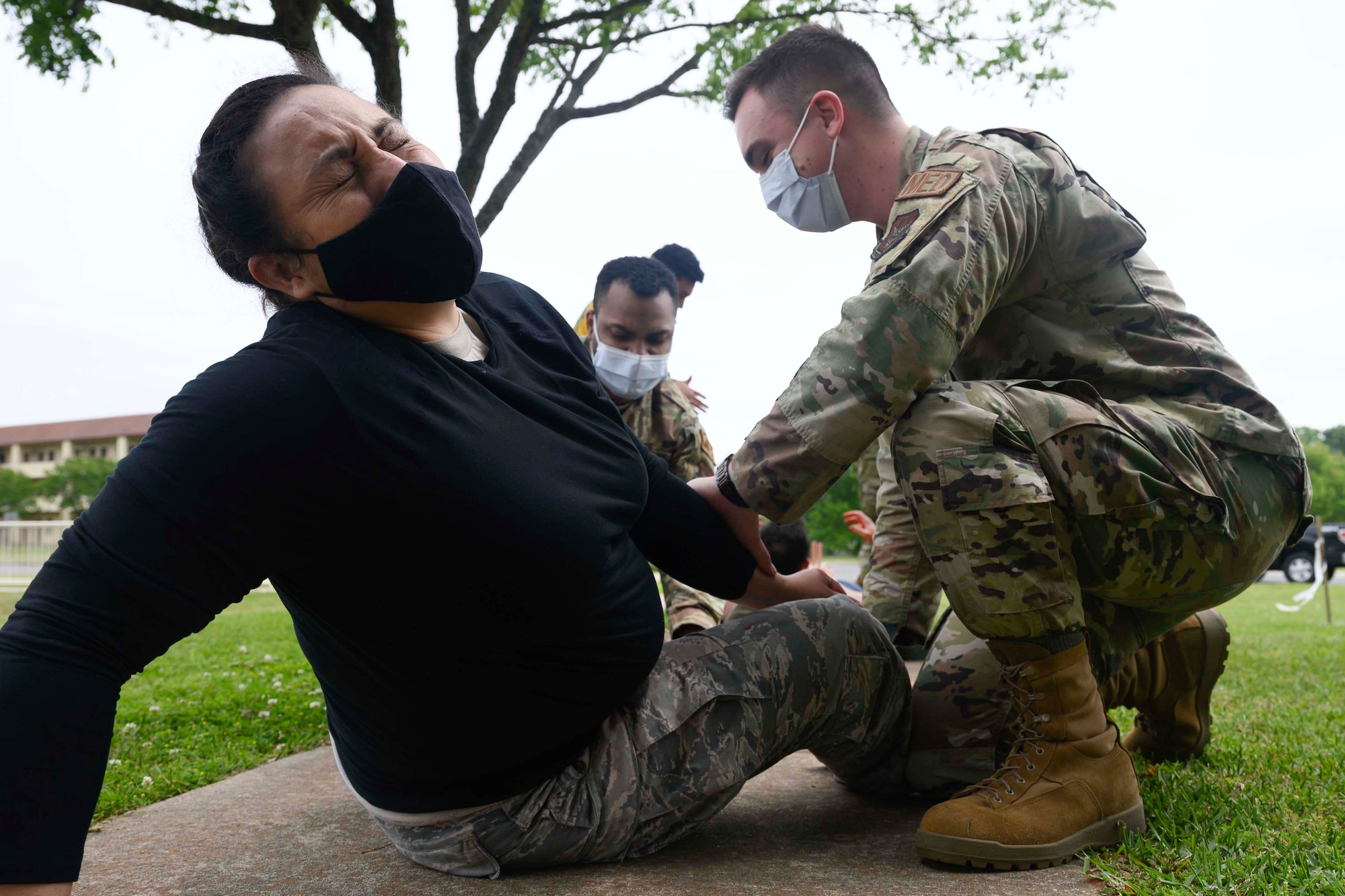 Photo of Airman taking part in a simulated casualty exercise.