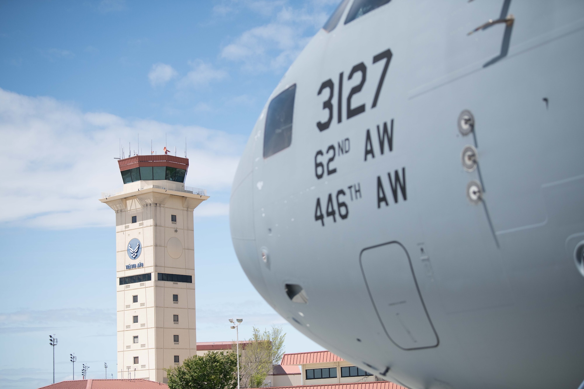 A C-17 aircraft flies upward over Travis AFB, Calif.