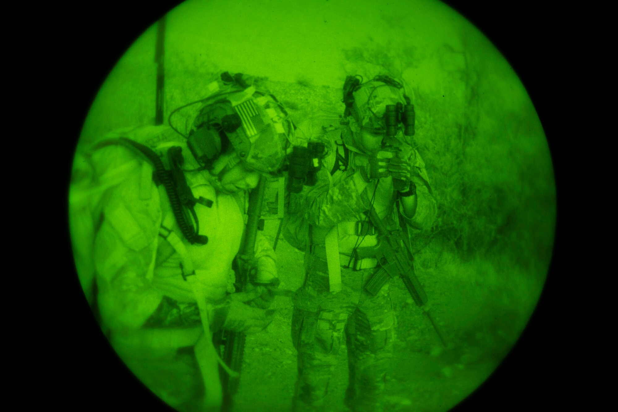 Two U.S. Air Force Tactical Air Control Party specialists check their compass during the 2021 Wraith Challenge, April 21, 2021, at Chuck Heinrich Memorial Park, Texas. There were two portions to the land navigation test, a day test and a night test. (U.S. Air Force photo by Airman 1st Class Jessica Sanchez)