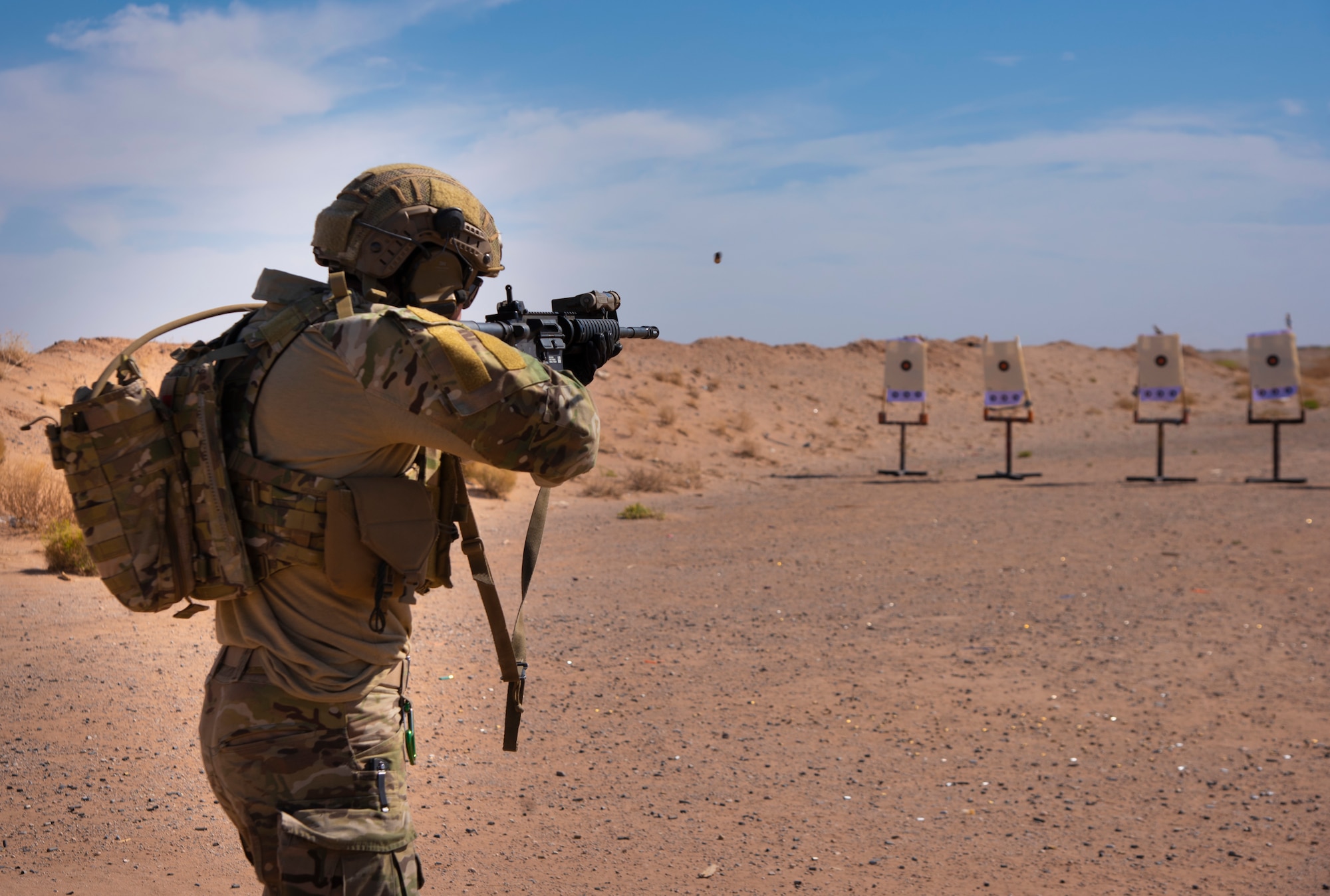 A U.S. Air Force Tactical Air Control Party specialist shoots an M-4 carbine at a target during the 2021 Wraith Challenge, April 21, 2021, on Fort Bliss Rod and Gun Club, Texas. The TACP specialists went through the Navy qualification course of fire, giving the competitors the opportunity to qualify for marksmanship on Navy regulations which will earn them Navy ribbons and medals. (U.S. Air Force photo by Airman 1st Class Jessica Sanchez)