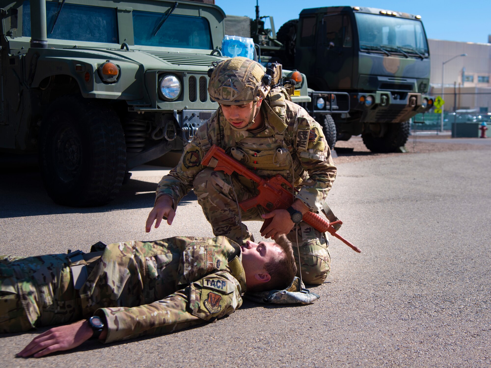 A U.S. Air Force Tactical Air Control Party specialist tends to a simulated casualty during a combat lifesaver skills scenario at the 2021 Wraith Challenge, April 23, 2021, on Fort Bliss, Texas. Participants were tested on their ability to analyze a situation, perform emergency aid, and bring victims to safety until more trained medical units could arrive. (U.S. Air Force photo by Airman 1st Class Jessica Sanchez)