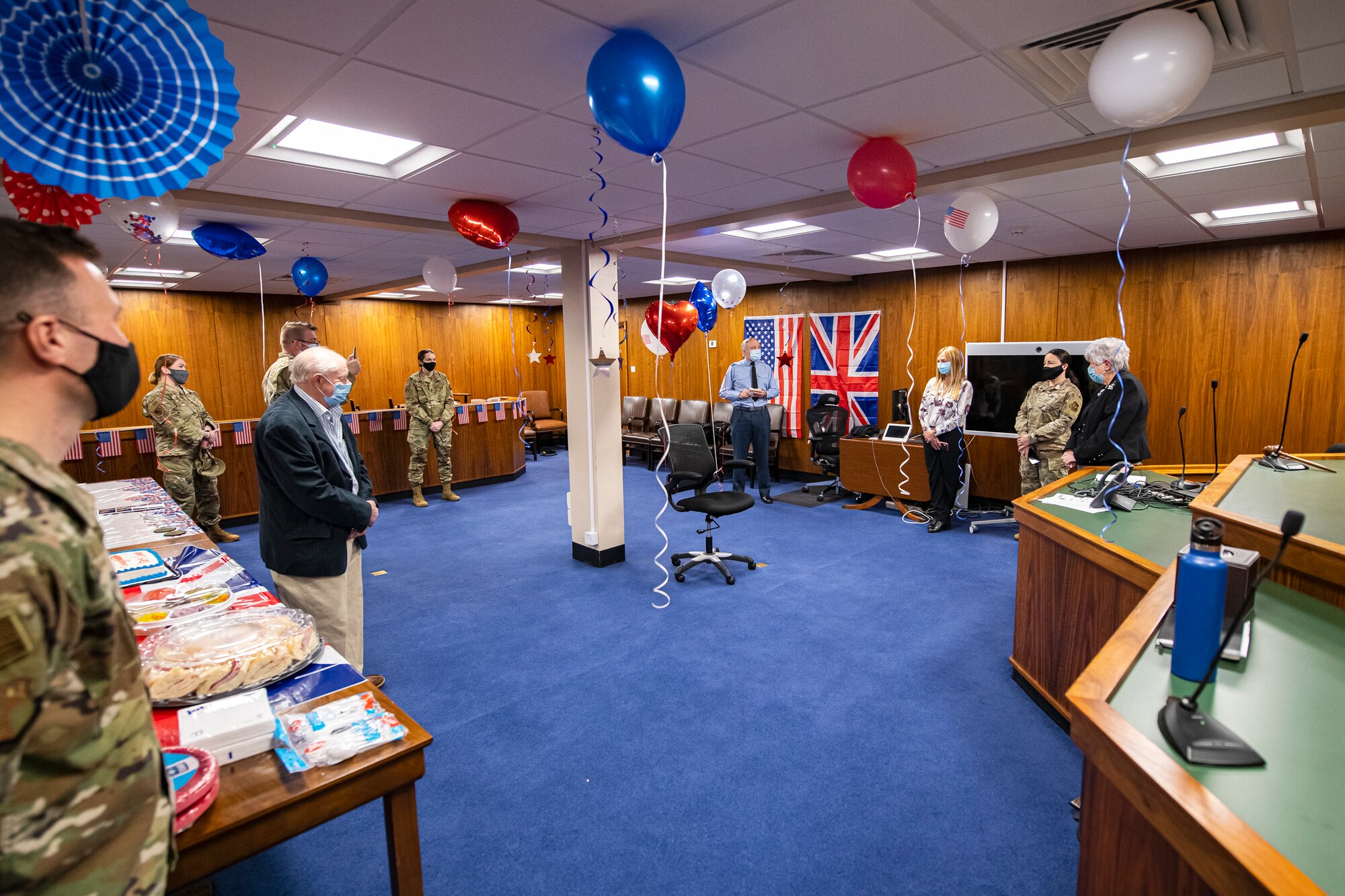The 501st Combat Support Wing judge advocate office hosts a celebration for Valerie Lucas, right, 501st CSW British liaison officer, at RAF Alconbury, England, April 23, 2021. The 501 CSW/JA office celebrated Mrs. Lucas for her 60 years of service as the British liaison officer at RAF Alconbury. (U.S. Air Force photo by Senior Airman Eugene Oliver)