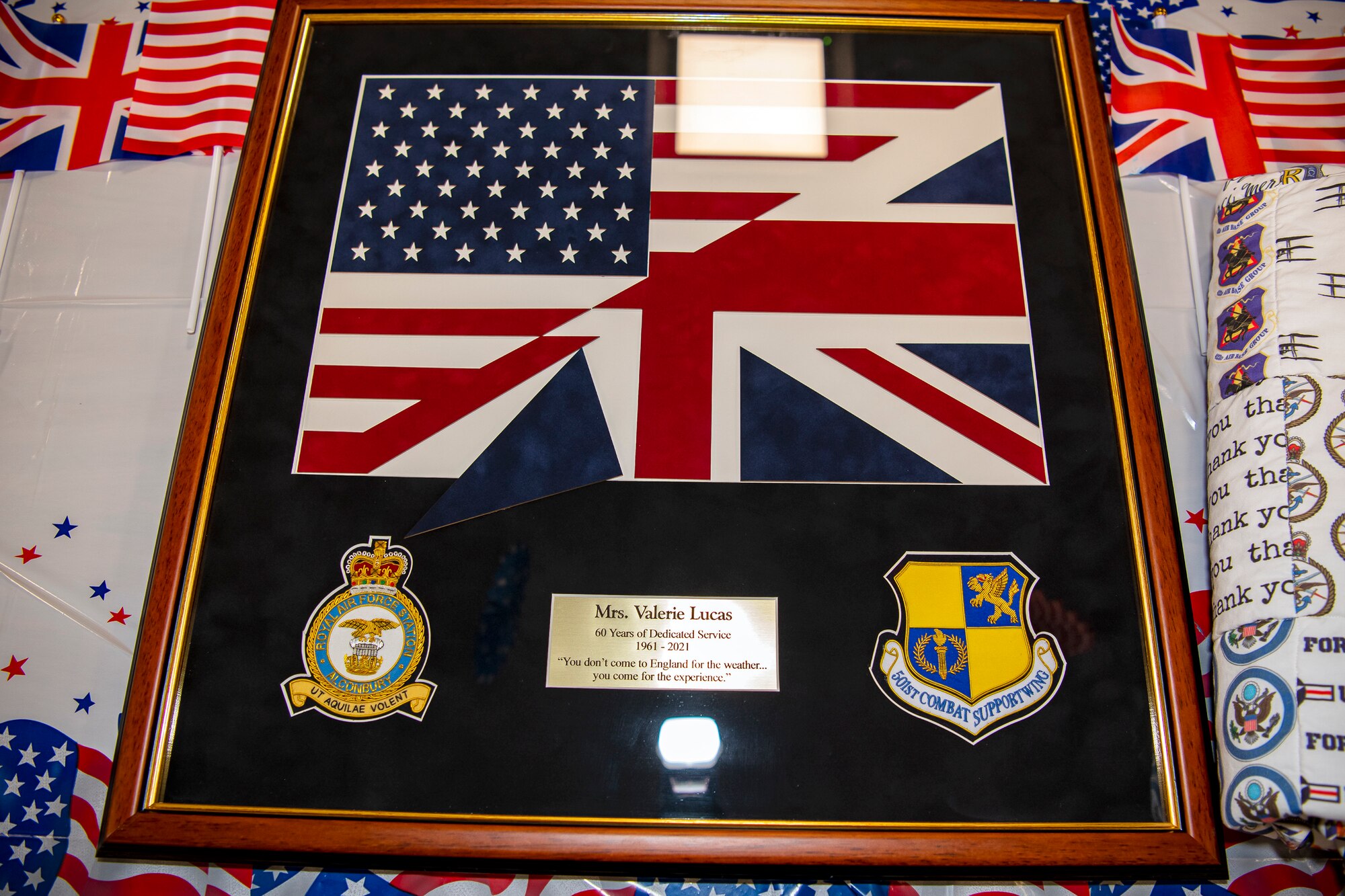 An award celebrating Valerie Lucas, 501st Combat Support Wing British liaison officer, rests on a table prior to a celebration at RAF Alconbury, England, April 23, 2021. The 501 CSW/JA office celebrated Mrs. Lucas for her 60 years of service as the British liaison officer at RAF Alconbury. (U.S. Air Force photo by Senior Airman Eugene Oliver)