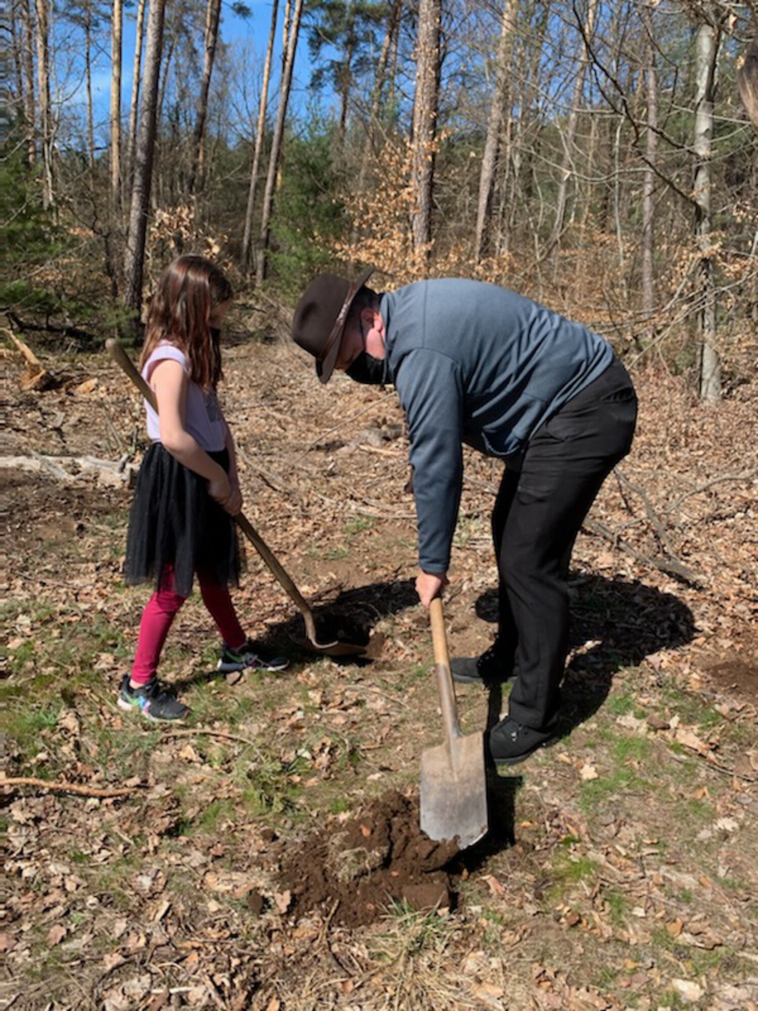 Erik Lagerquist, 86th Civil Engineer engineering flight chief, and his daughter, Courtney, plant an oak tree during Earth Day at Ramstein Air Base.