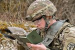 U.S. Army 1st Lt. Paige Runco, assigned to Landstuhl Regional Medical Center, plots coordinates during the MEDDAC Bavaria Best Warrior Competition at the Grafenwoehr Training Area, Germany, April 11, 2021. Competitors were tested for agility, mature judgement, physical fitness, warrior skills, land navigation and overall knowledge of medical, technical and tactical proficiencies through a series of hands-on tasks in a simulated operational environment.