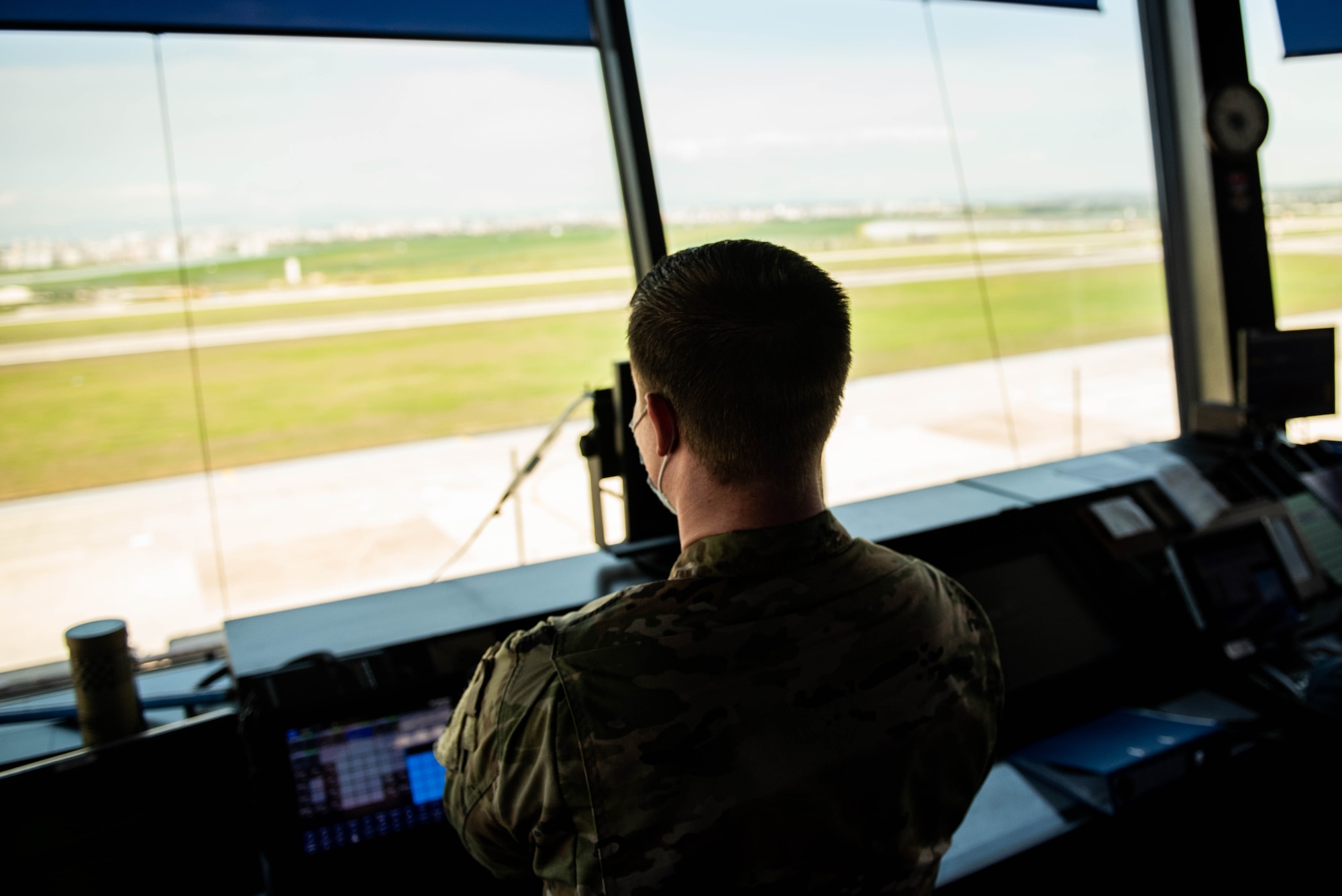An Airman works in the ATC tower
