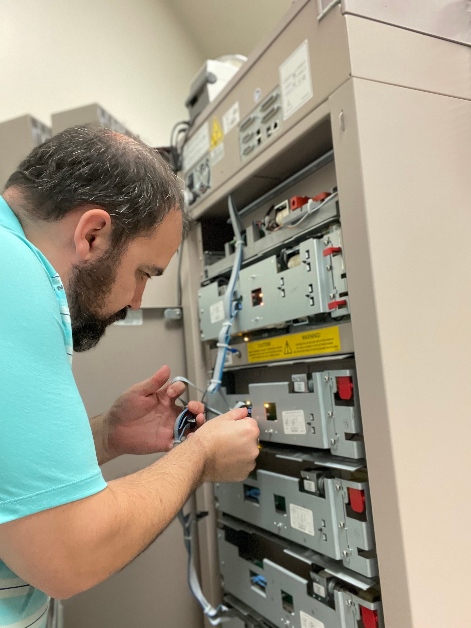 Ryan Porterfield, a pharmacy technician with the 88th Diagnostics and Therapeutics Squadron, works on a Pyxis medical station unit recently at Wright-Patterson Medical Center. The system enables better tracking of controlled medications throughout the hospital. (Contributed photo)