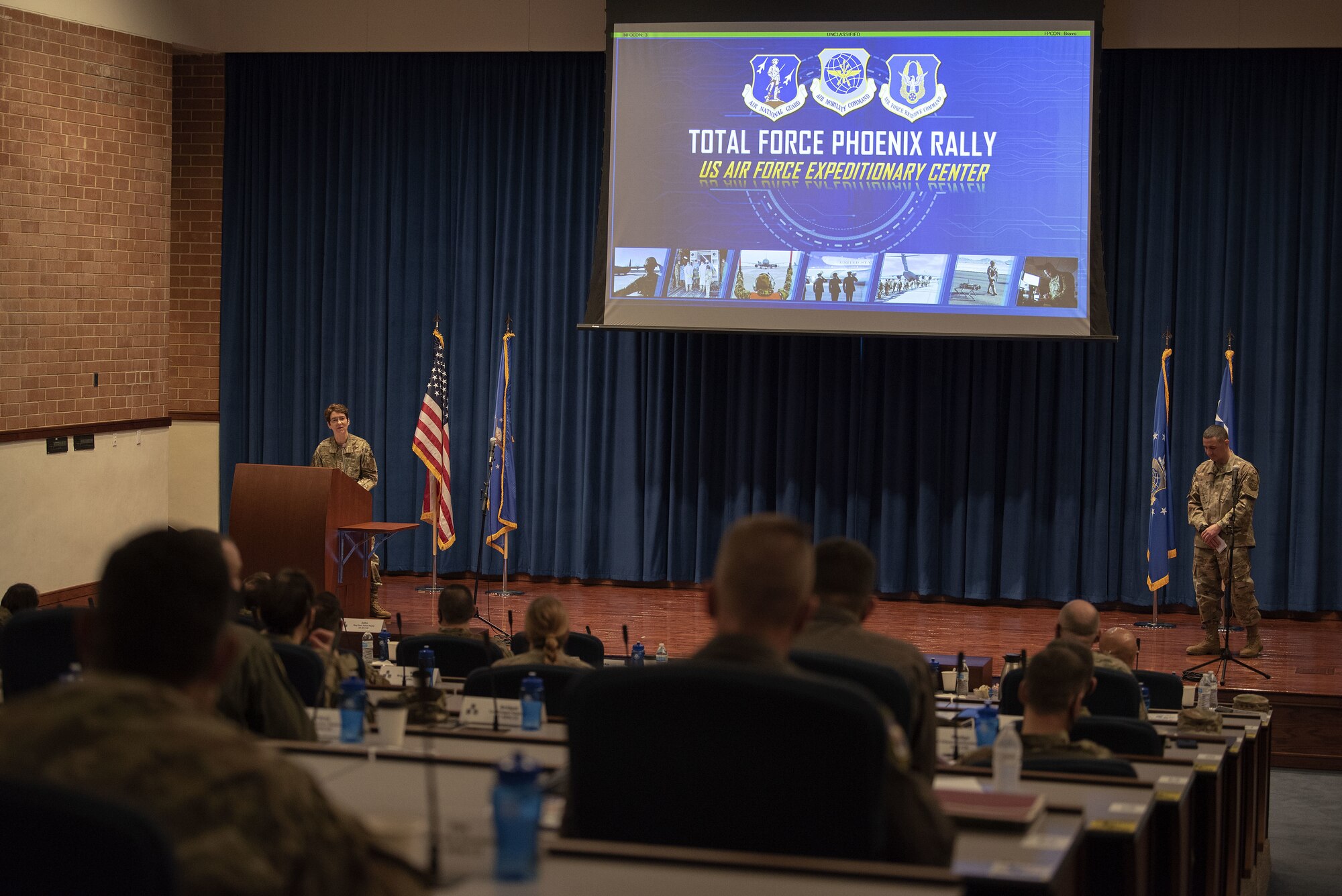 U.S. Air Force Gen. Jacqueline Van Ovost, Air Mobility Command commander, gives opening remarks with U.S. Air Force Chief Master Sgt. Brian Kruzelnick, AMC command chief, during Total Force Phoenix Rally, April 20, 2021, at the U.S. Air Force Expeditionary Center headquarters on Joint Base McGuire-Dix-Lakehurst, New Jersey. The event allows leadership across the Total Force Mobility Air Forces to discuss their perspectives and how they support AMC’s priorities: develop the force, advance warfighting capabilities, project the joint force and ensure strategic deterrence. (U.S. Air Force photo by Master Sgt. Ashley Hyatt)