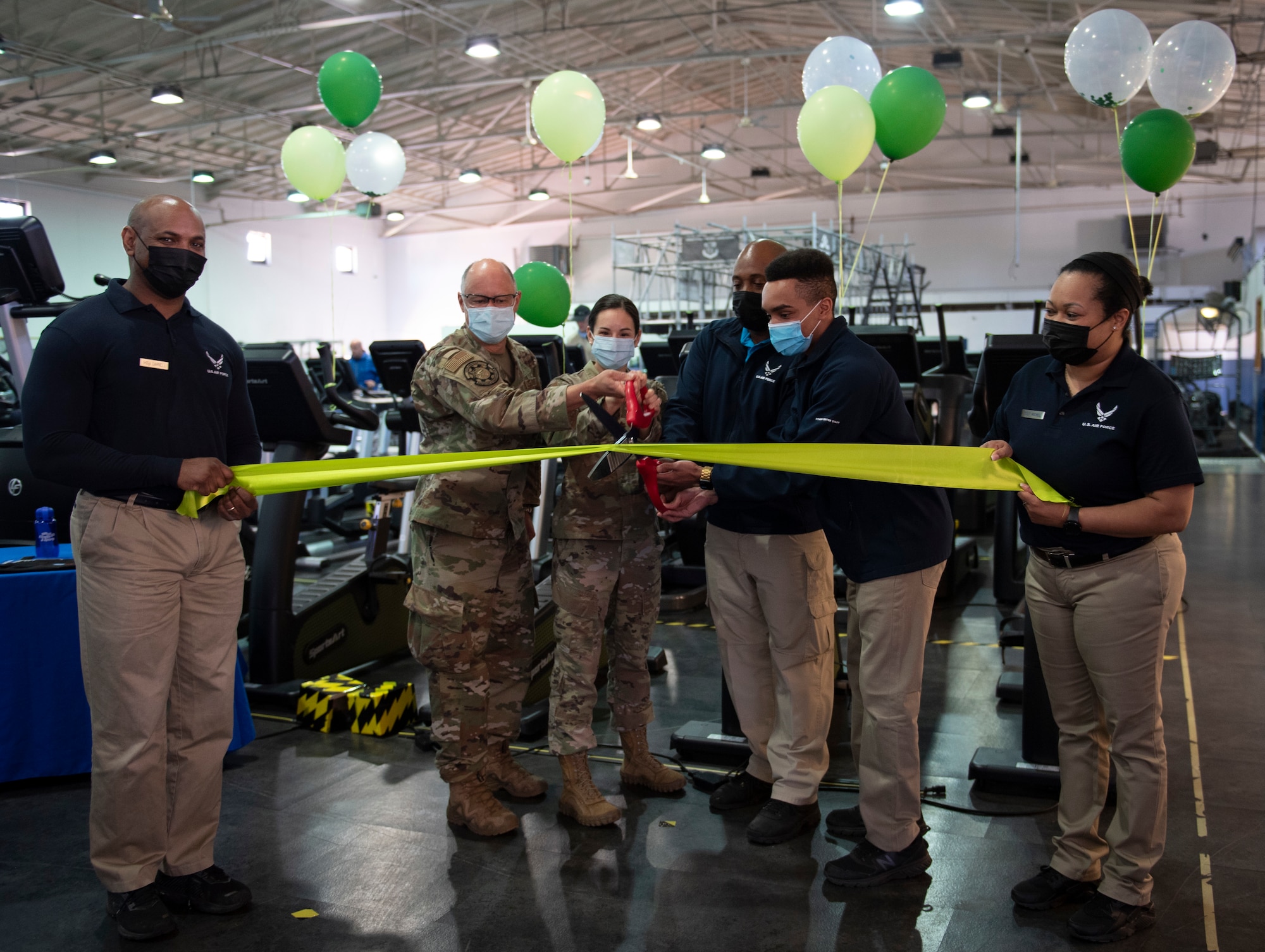 People cutting ribbon to celebrate new equipment