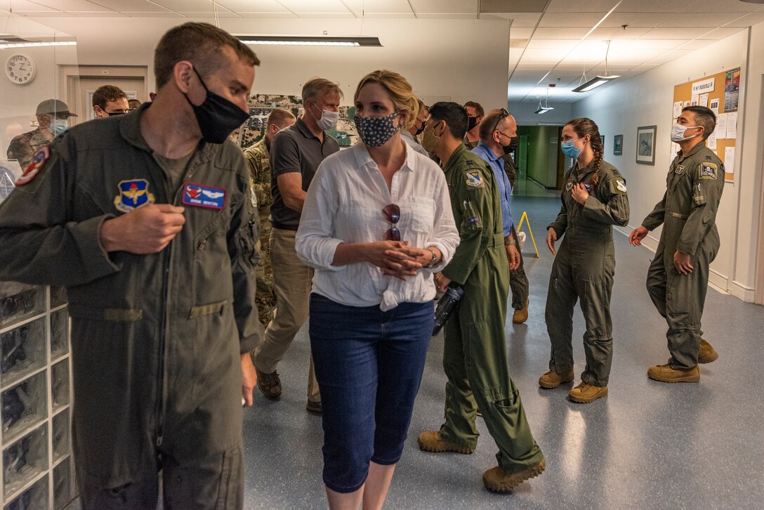 Capt. John Benson, 87th Flying Training Squadron instructor pilot, introduces himself to U.S. Rep. Ashley Hinson as they walk to the training simulators, on April 8, 2021 at Laughlin Air Force Base, Texas. The group of congressional members experienced how Team XL trains combat-ready Airmen, leaders and pilots through a hands-on trail of the simulators with the direction of the instructor pilots who mold future generations of aviators. (U.S. Air Force photos by Senior Airman Anne McCready)