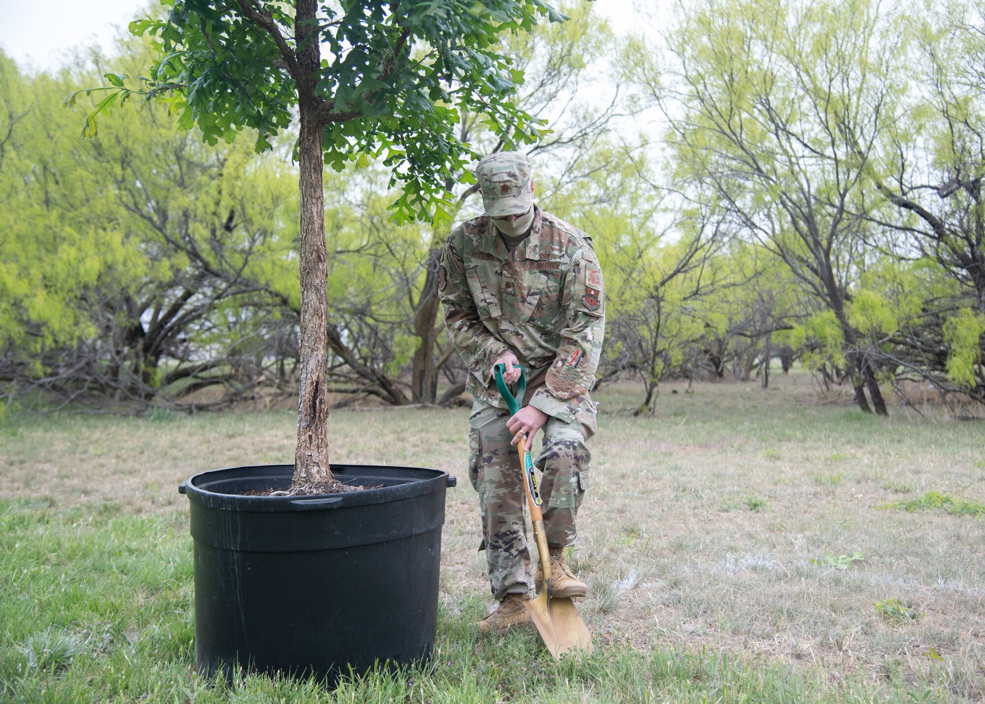 U.S. Air Force Maj. Christopher Higgins, 17th Civil Engineer Squadron commander, breaks ground to plant a Bur Oak tree on Goodfellow Air Force Base, Texas, April 21, 2021. This tree was planted for Earth Day 2021’s theme of “Restore Our Earth”, which focuses on innovative thinking that can improve the world’s ecosystems. (U.S. Air Force photo by Staff Sgt. Tyrell Hall)