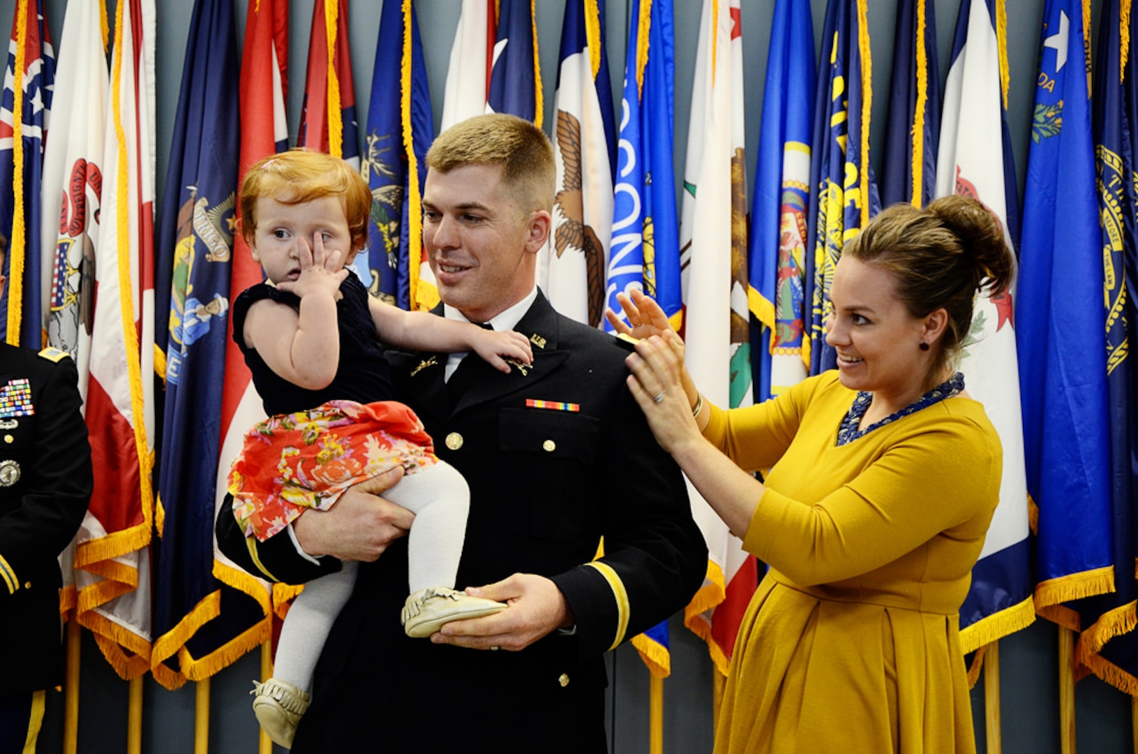 Seven officer candidates enrolled in the Virginia Guard’s Officer Candidate School receive their commissions and grade from OCS Sept. 27, 2014, at Fort Pickett’s 183rd Regiment, Regional Training Institute in front of family, friends and Virginia Army National Guard Soldiers and leaders. The Soldiers were part of Class 57B, and successfully completed the summer accelerated OCS program which began in July. (Photo by Staff Sgt. Terra C. Gatti, Virginia Guard Public Affairs)