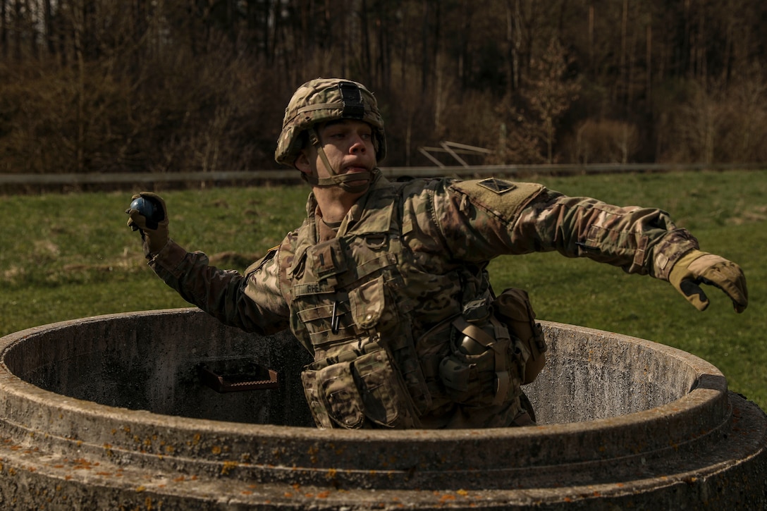 A soldier throws a decoy grenade.