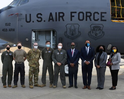 Bahamian Ambassador to the U.S., Ambassador Sidney Collie, poses with the Col. Greg Buchanan, 459th ARW Commander, members of the wing and Bahamian embassy staff for a photo April, 21, 2021, at Joint Base Andrews, Md. The wing was responsible for the transporting of 100 laptops to The Bahamas as part of a humanitarian mission that would allow underprivileged kids to have refurbished laptops after the effects of Hurricane Dorian destroyed schools on the island. (U.S. Air Force photo by Staff Sgt. Cierra Presentado/Released)