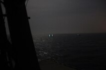 210426-N-NO146-1005 ARABIAN GULF (April 26, 2021) Three Iranian Islamic Revolutionary Guard Corps Navy (IRGCN) fast inshore attack craft (FIAC) approach the patrol coastal ship USS Firebolt (PC 10), while the U.S. vessel was conducting routine maritime security patrols in the international waters of the North Arabian Gulf, April 26. Firebolt is assigned to U.S. Naval Forces Central Command’s Task Force (TF) 55. (U.S. Navy Photo)