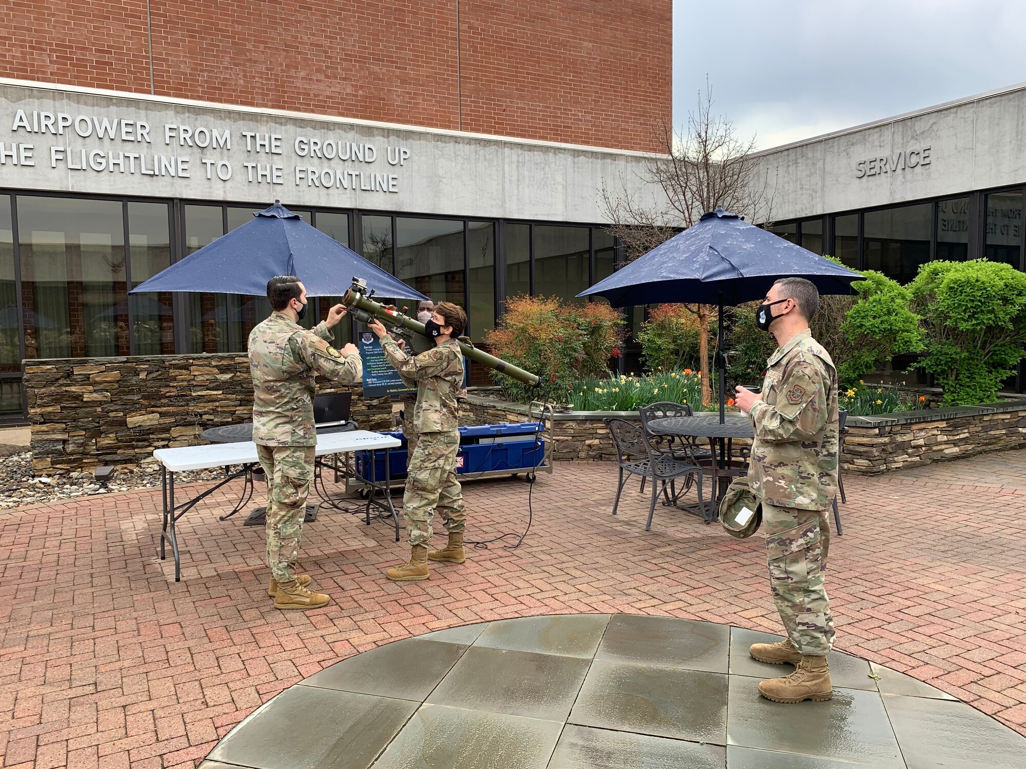 U.S. Air Force Staff Sgt. Matthew Messina, 423rd Mobility Training Squadron operations intelligence analyst, shows Gen. Jacqueline Van Ovost, AMC commander, a threat trainer system that Mobility Air Forces Intelligence Formal Training Unit students utilize during the course, April 21, 2021, at the U.S. Air Force Expeditionary Center headquarters on Joint Base McGuire-Dix-Lakehurst, New Jersey. (U.S. Air Force photo by Air Mobility Command)