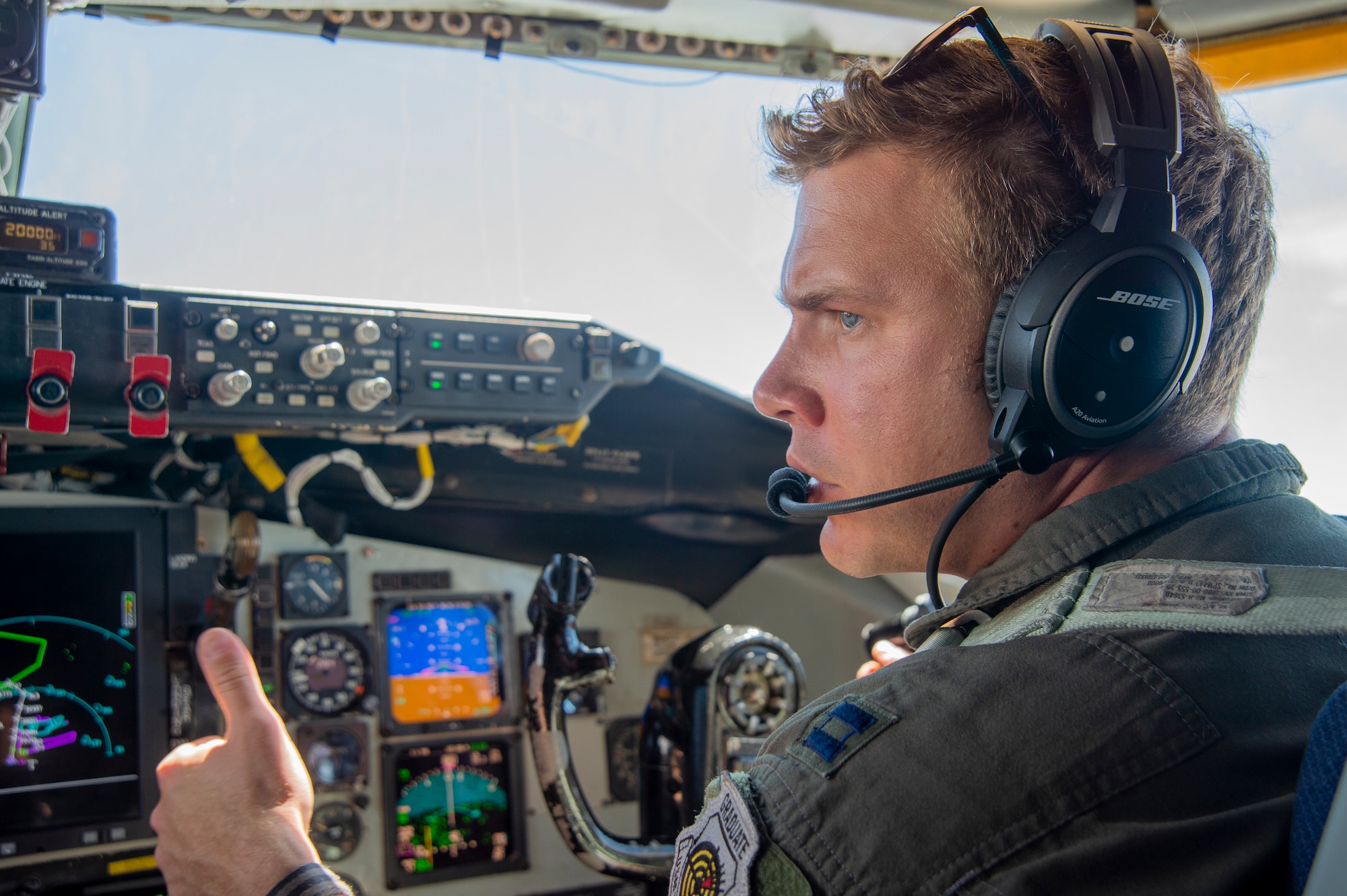 Capt. Vincent T. Jovene III, a 91st Air Refueling Squadron instructor pilot, signals to his co-pilot while flying a KC-135 Stratotanker aircraft from MacDill Air Force Base, Fla., April 18, 2021. Jovene III and Capt. Giovanny Parra, a 91st ARS pilot, provided air refueling support to an F-22 Raptor and an A-10 Thunderbolt II after the SUN ‘n FUN Aerospace Expo located in Lakeland, Fla. (U.S. Air Force photo by Airman 1st Class David D. McLoney)