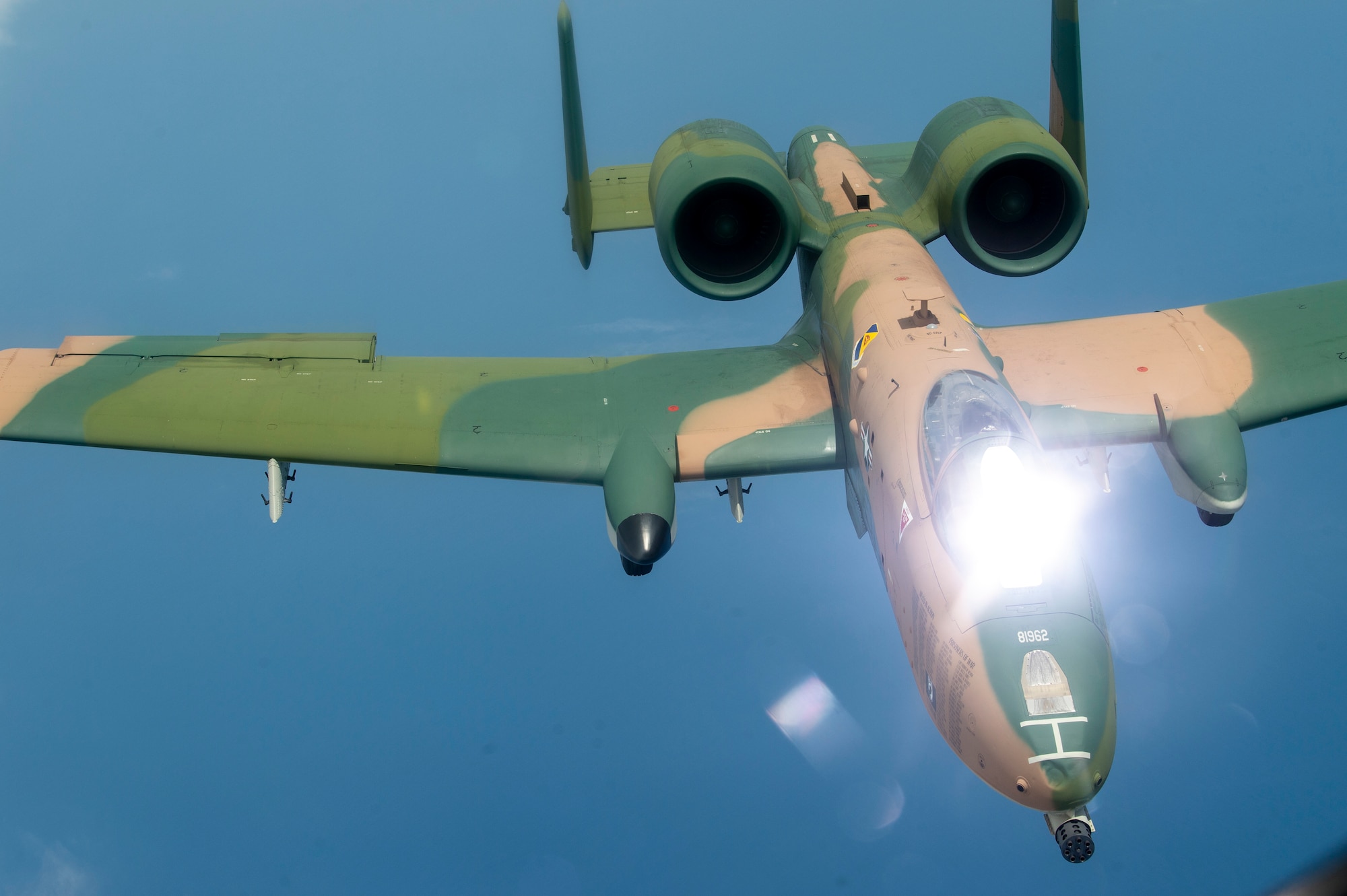 An A-10 Thunderbolt II aircraft flies through the air after being refueled by a KC-135 Stratotanker aircraft from MacDill Air Force Base, Fla., April 18, 2021.  The A-10, with its new paint job, participated in the SUN ‘n FUN Aerospace Expo located in Lakeland, Fla., as well as the Cocoa Beach Air Show. (U.S. Air Force photo by Airman 1st Class David D. McLoney)