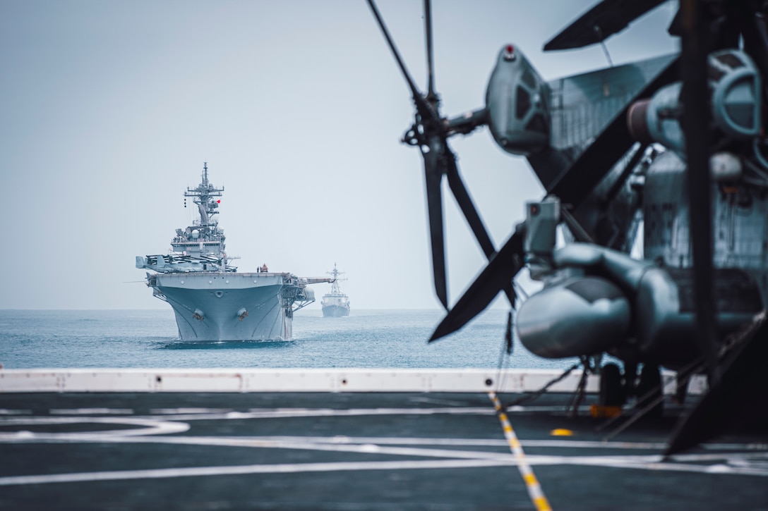 Amphibious assault ship USS Essex (LHD 2), left, and guided-missile destroyer USS Kidd (DDG 100) sail in formation behind amphibious transport dock ship USS Portland (LPD 27), April 20. The Marines and Sailors of the 11th Marine Expeditionary Unit are conducting routine training as part of the Essex Amphibious Ready Group. Together, the 11th MEU, Amphibious Squadron 1, and ships are designated as an ARG.