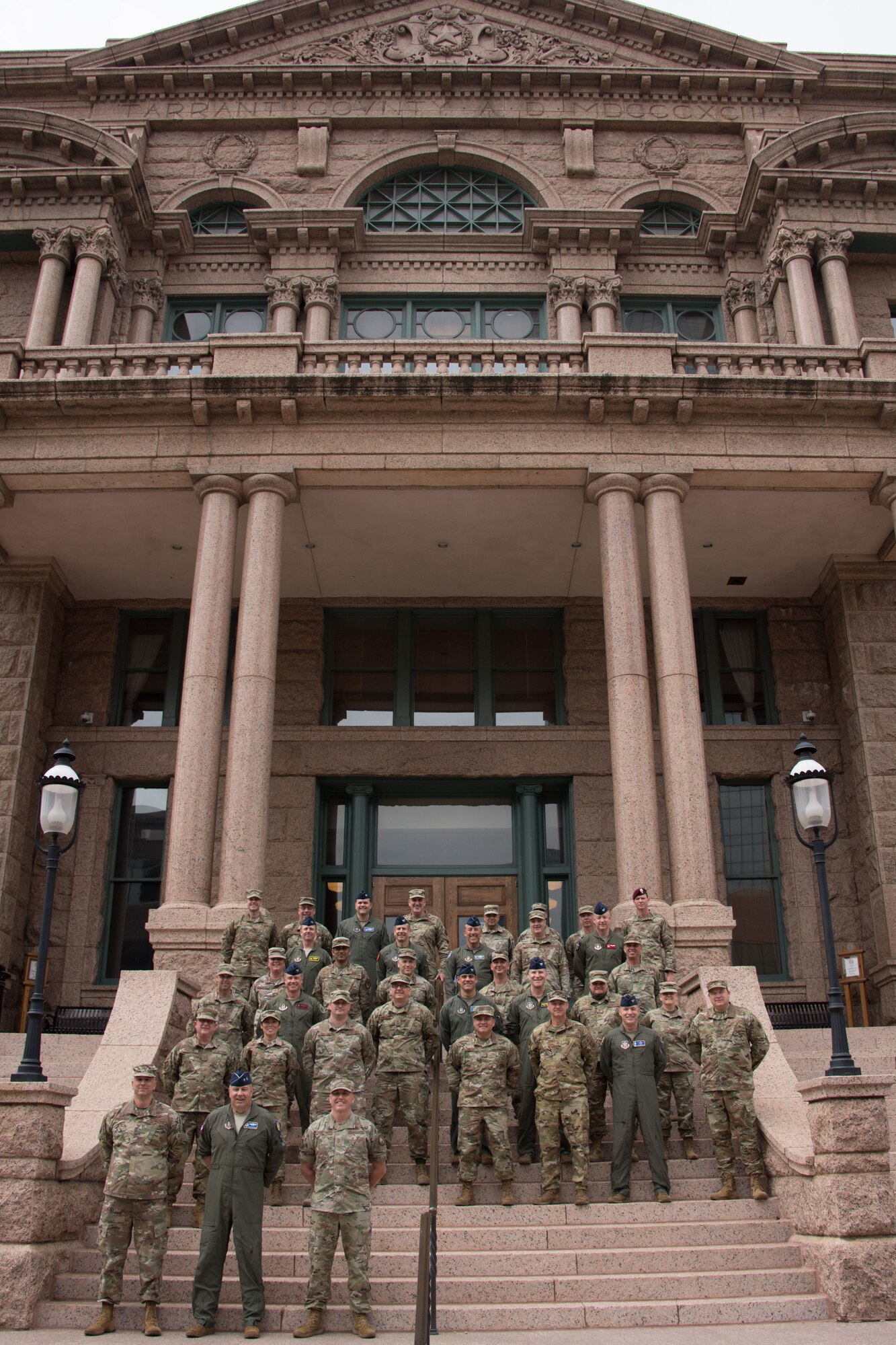 Members of 10th Air Force took a break during the 2021 Commanders and Command Chiefs Conference to take a photo in front of the Fort Worth Courthouse.