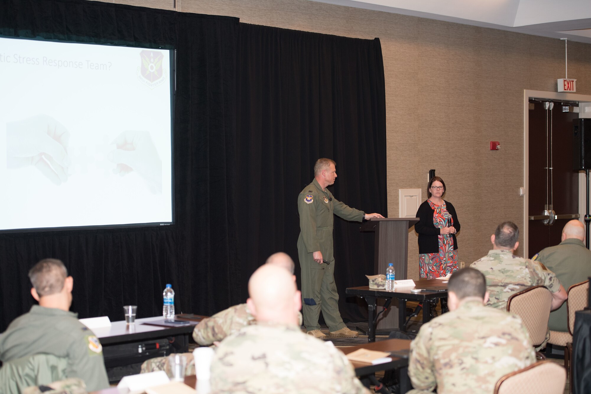 Colonel Allen Duckworth, 301st Fighter Wing Commander, and Ms. Mary Arnold, 301st Fighter Wing Director of Psychological Health, discuss the Traumatic Stress Response Team during the 10th Air Force Commanders and Command Chiefs Conference in Downtown Fort Worth.