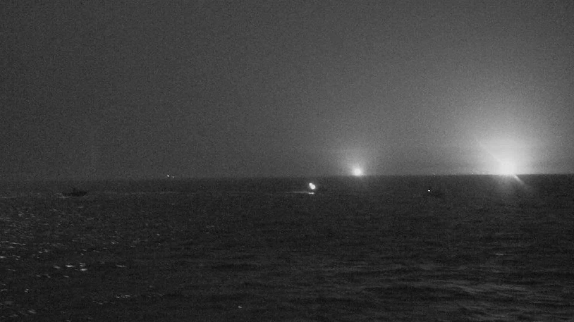 210426-N-NO146-1002 ARABIAN GULF (April 26, 2021) Three Iranian Islamic Revolutionary Guard Corps Navy (IRGCN) fast inshore attack craft (FIAC) approach the U.S. Coast Guard patrol boat USCGC Baranof (WPB 1318) and patrol coastal ship USS Firebolt (PC 10), while the U.S. vessels were conducting routine maritime security patrols in the international waters of the North Arabian Gulf, April 26. Firebolt is assigned to U.S. Naval Forces Central Command’s Task Force (TF) 55 and Baranof is assigned to Patrol Forces Southwest Asia (PATFORSWA), the largest U.S. Coast Guard unit outside the United States, and operates under TF 55. (U.S. Navy Photo)