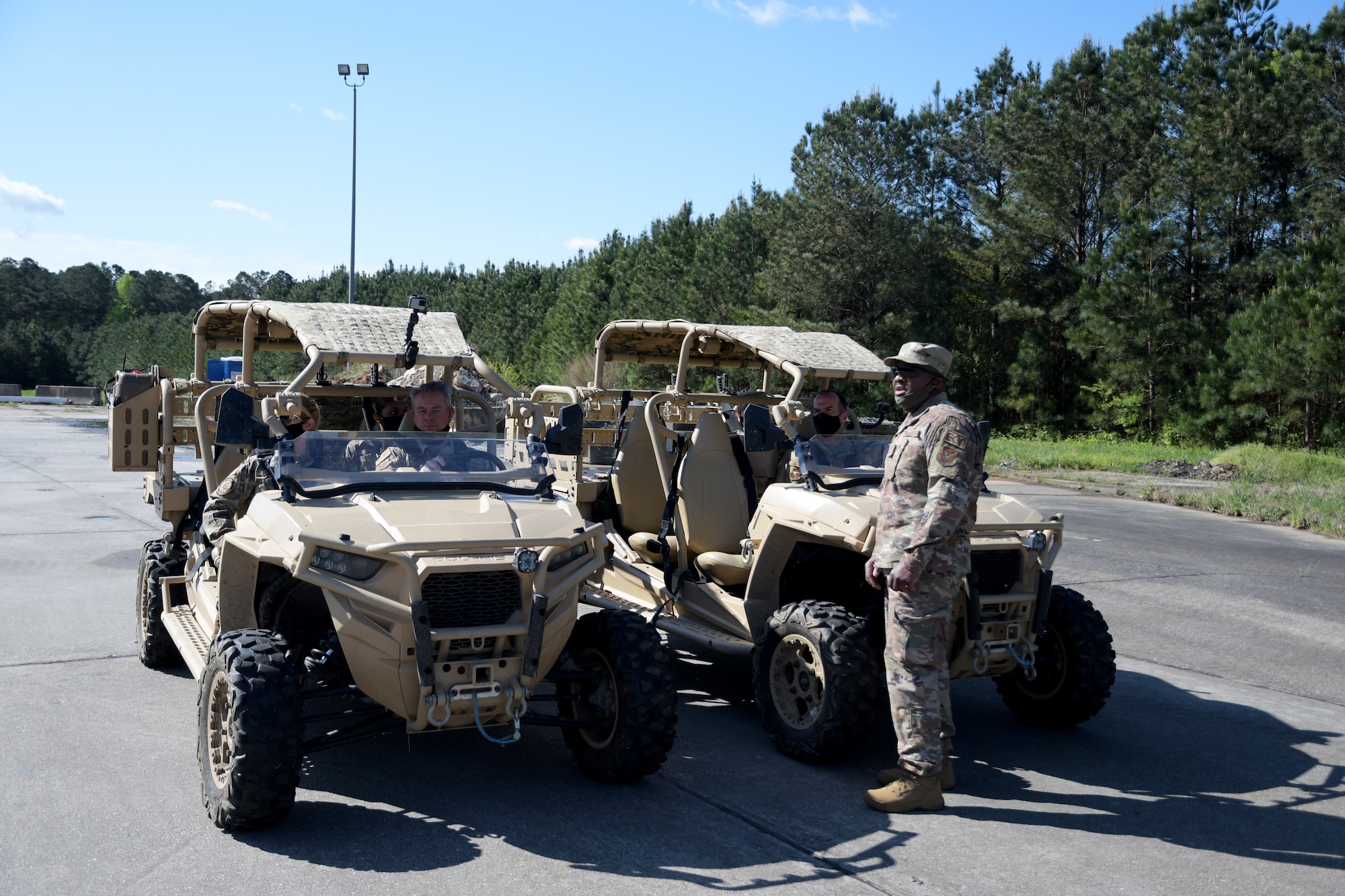 Maj. Gen. John P. Healy, 22nd Air Force commander, and Col. Craig McPike, 94th Airlift Wing commander, drive RZR off road vehicles during a tour at Dobbins Air Reserve Base, Ga, on April 11, 2021. (U.S. Air Force Photo by Staff Sgt. Justin Clayvon)
