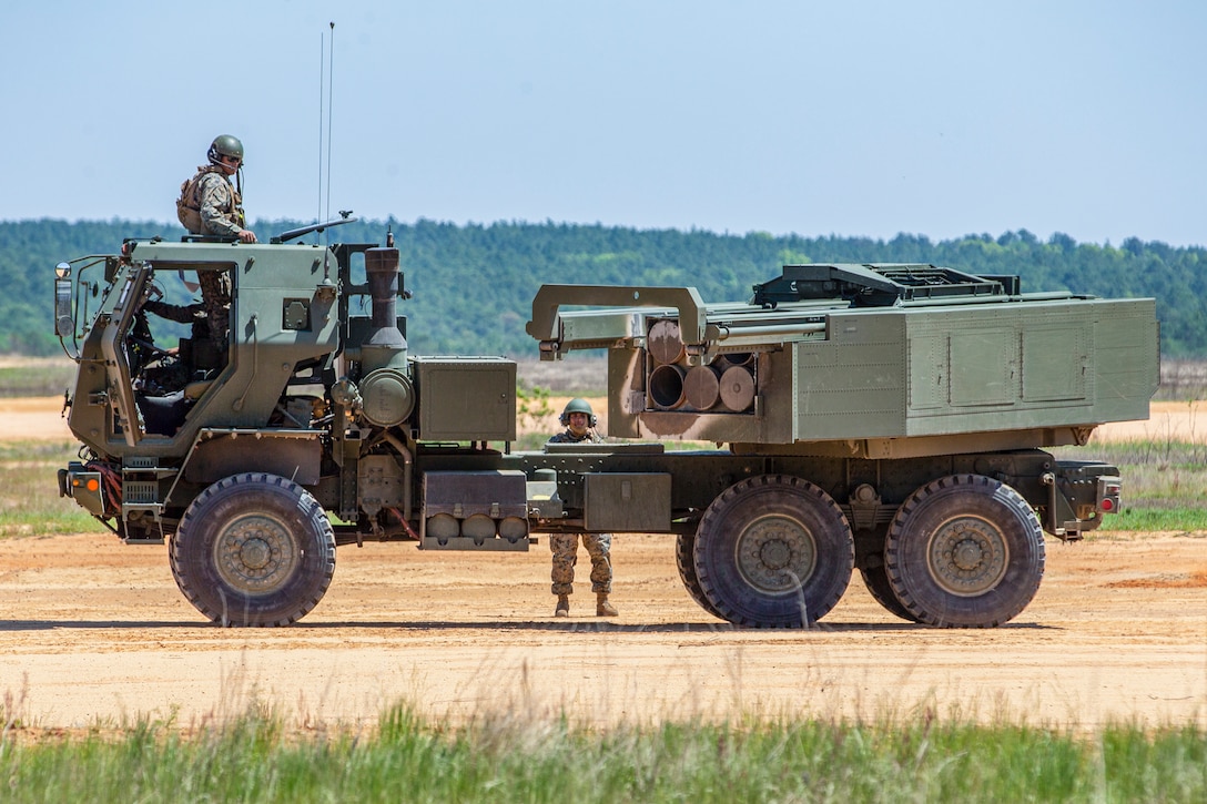 U.S. Marines with 1st Battalion, 10th Marine Regiment, 2nd Marine Division, load a High Mobility Artillery Rocket System with 227mm rockets during Exercise Rolling Thunder 21.2 on Fort Bragg, N.C., April 26, 2021. This is a live-fire artillery exercise where 10th Marines employed distributed fires via simulated Expeditionary Advanced Bases. The training increased 2nd MARDIV’s combat readiness against a peer competitor. HIMARS are an advanced long-range and mobile rocket system that allows 2nd MARDIV to employ precision fires onto a target.