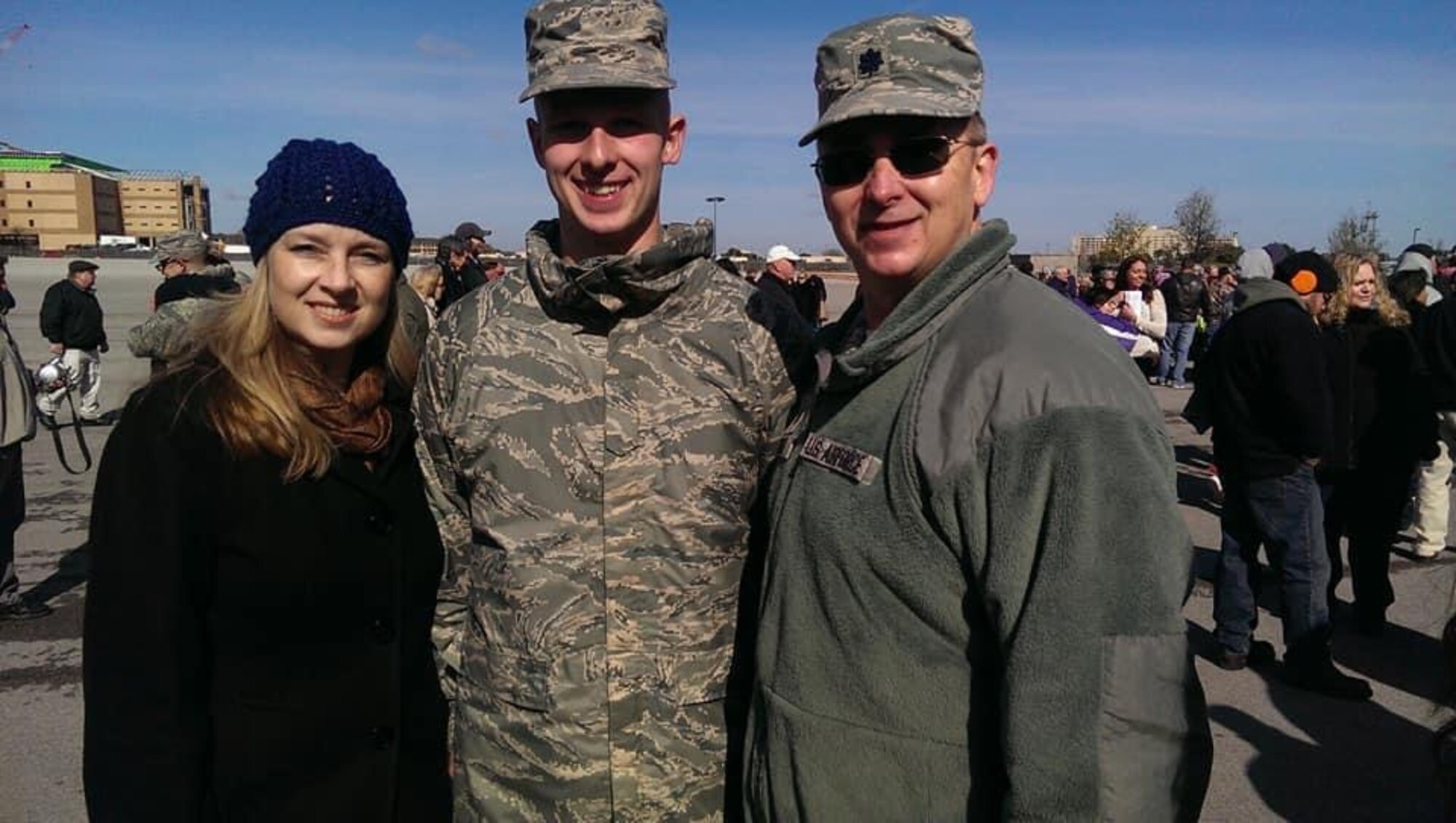 Staff Sgt. Brendan Miller, Armed Force Network Tokyo broadcaster, poses with his father, Lt. Col. Mark Miller, and his mother, Laura Miller, after graduating Air Force Military Training, Nov. 19, 2014 at Lackland Air Force Base, San Antonio, Texas.