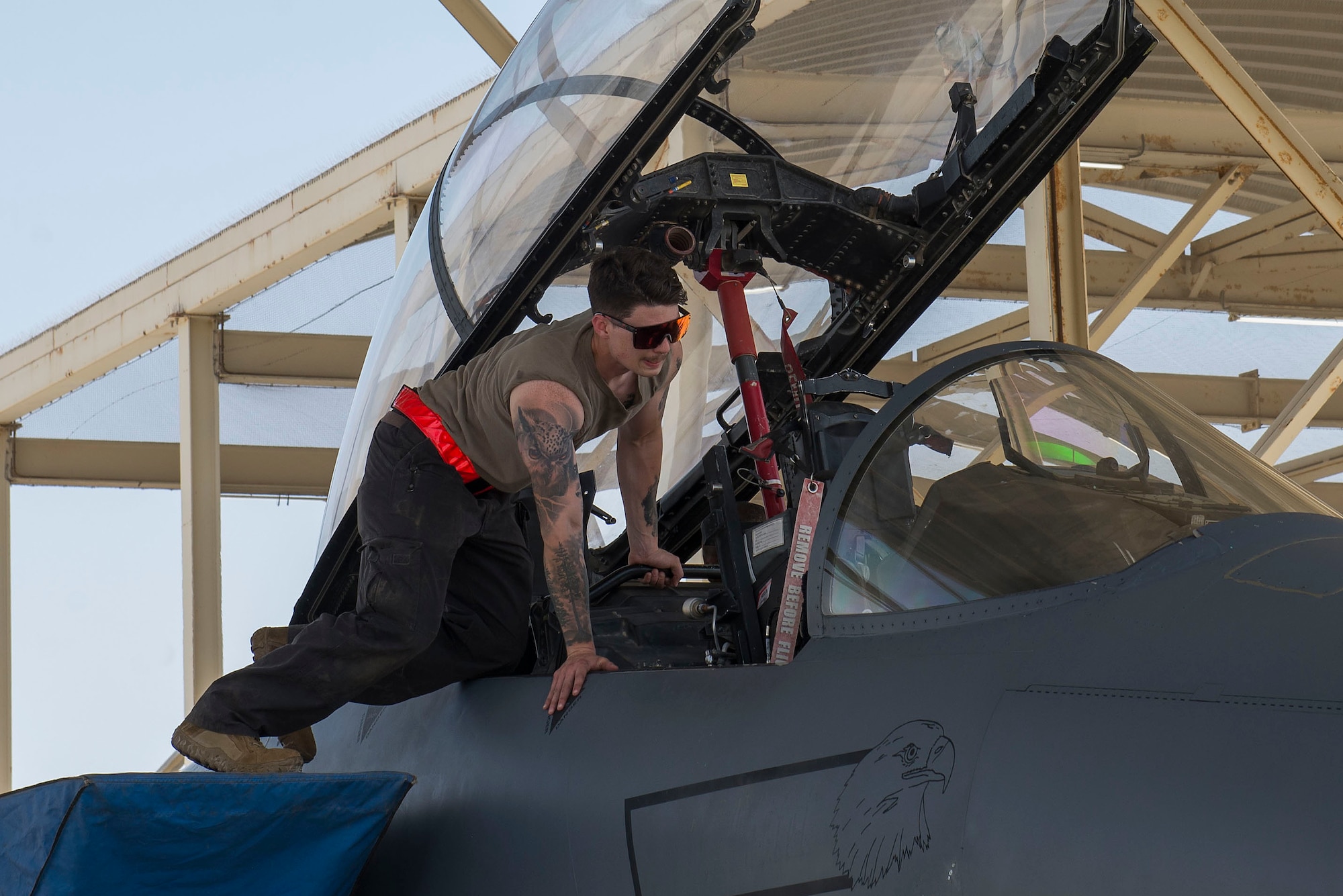 A crew chief assigned to the 380th Expeditionary Maintenance Group performs post-flight procedures on an F-15E Strike Eagle at Al Dhafra Air Base, United Arab Emirates, April 25, 2021.