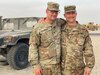 Spc. Tyler Goldsberry (left), 2nd General Support Battalion, 104th Aviation Regiment and chief warrant officer Craig Goldsberry (right), 111th Engineer Brigade, son and father respectively, pose for a photo in Kuwait, April 2021. The two are currently deployed to Kuwait in support of Operation Spartan Shield; and although assigned to different units, their deployment timelines overlap by nearly two months allowing for a long-awaited reunion between this father and son duo.