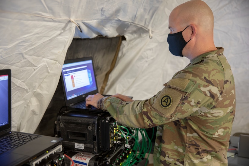 Army Master Sgt. Brian Chapman, Information Systems Division Non-commissioned Officer in Charge for U.S. Army Central G6 inspects their PacStar kits during validation for the new Relocatable Emergency Command Post at Camp Arifjan, Kuwait, April 12 2021. This technology further develops the capabilities and increases the U.S. Armed Forces overall readiness. (Photo by U.S. Army Sgt. Robert Torres, USARCENT PAO)