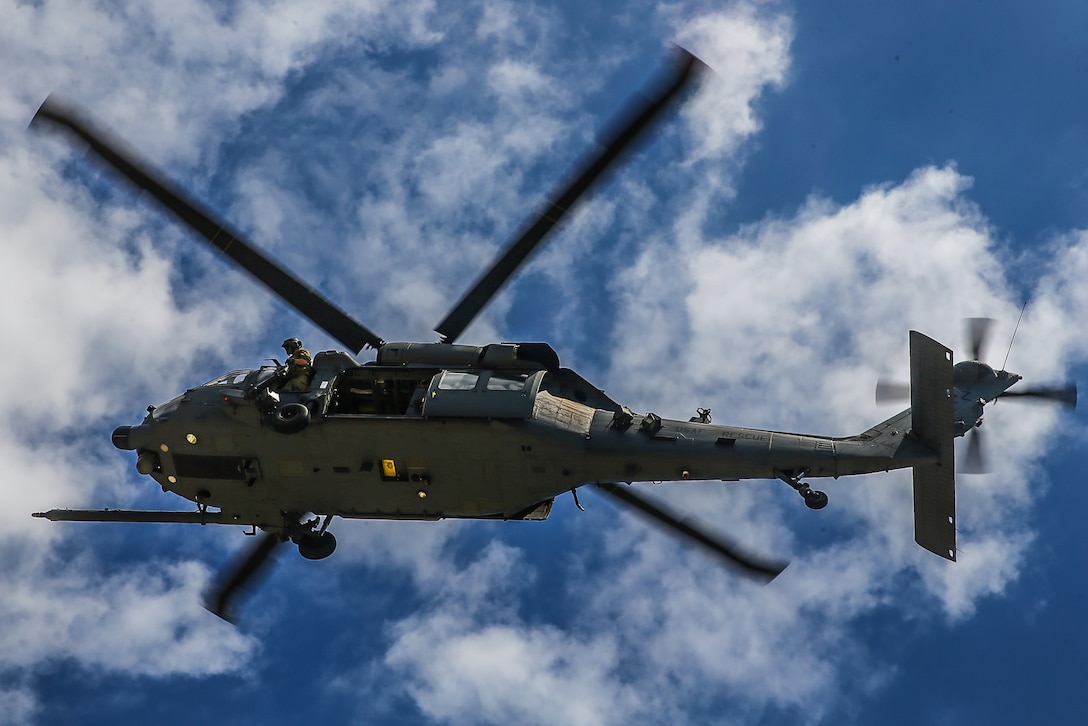 A U.S. Air Force HH-60W Jolly Green II prepares to extract reconnaissance Marines with 3rd Reconnaissance Battalion, 3rd Marine Division, on Kin Blue training area, Okinawa, Japan, April 20, 2021. Kin Blue served as a training location for 9th Engineer Support Battalion’s exercise Pacific Pioneer, as well as 3rd Recon Battalion’s Combat Rubber Raiding Craft training. 3rd Recon Battalion conducts amphibious reconnaissance, ground reconnaissance, surveillance, battlespace shaping, and specialized raids in support of the Marine Division and its subordinate elements, or a designated Marine Air-Ground Task Force. Pacific Pioneer serves as 9th ESB's Marine Corps Combat Readiness Evaluation as well as an opportunity to demonstrate the ability to establish and sustain expeditionary advanced bases with survivable force protection, practice naval integration, and position long range precision fires and tactical logistics nodes across littoral regions in support of naval operations. 3rd MLG, based out of Okinawa, Japan, is a forward deployed combat unit that serves as III MEF’s comprehensive logistics and combat service support backbone for operations throughout the Indo-Pacific area of responsibility.