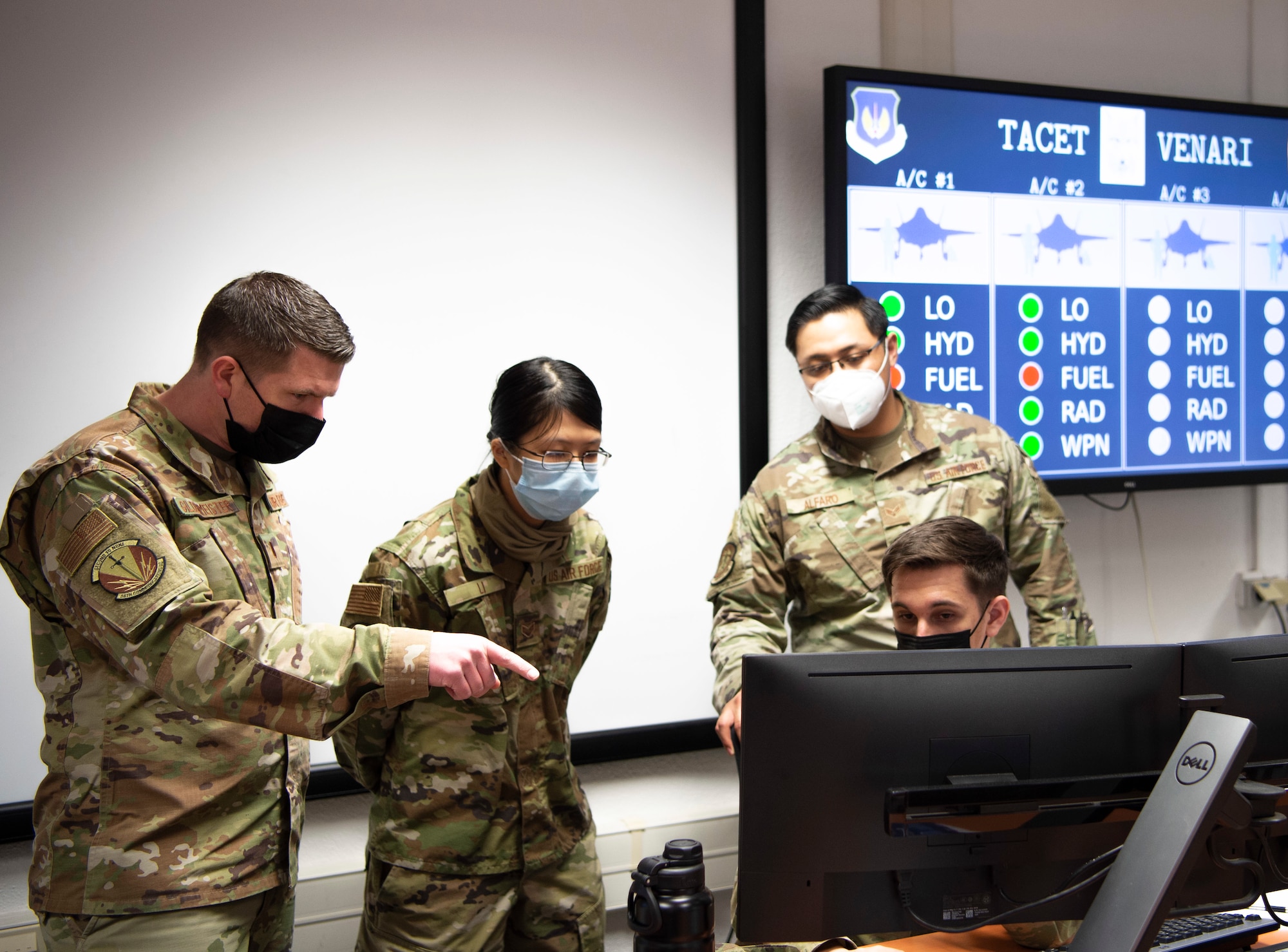 2nd Lt. Nicholas Gildenmeister, 86th Communication Squadron; Senior Airman Rose Li 86th CS; Senior Airman Dakota Lindberg, 52nd CS; and Senior Airman Marj Alfaro, 52nd CS, participate in the USAFE-led cyber exercise, Tacet Venari, at Ramstein Air Base, Germany, April 22, 2021. Tacet Venari is Latin for Silent Hunt, which describes the goal of the exercise: to hunt for adversaries within USAFE-AFAFRICA weapons systems. The exercise is one of several DoD-wide efforts to provide mission assurance and enhance command and control by providing warfighters the skills needed to deliver defensive cyber operations. (U.S. Air Force photo by 1st Lt. Hannah Durbin)
