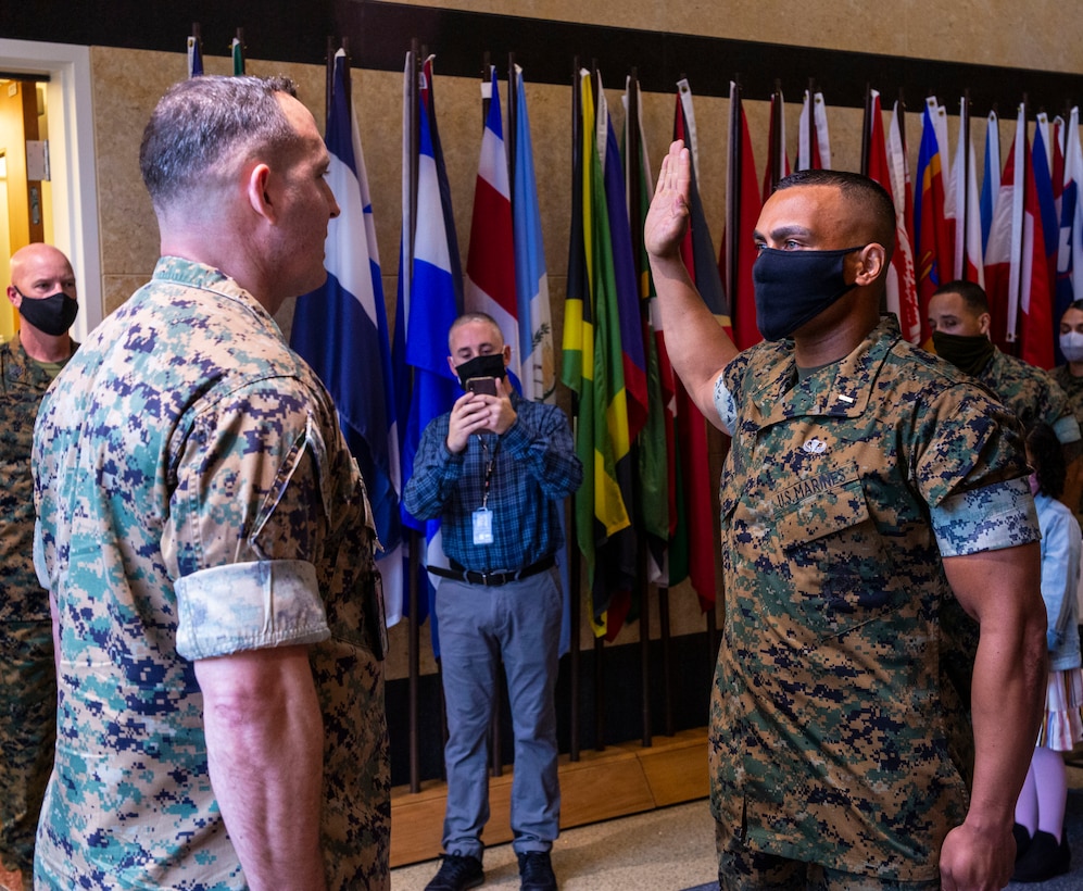 Former first sergeant, Alberto Andino, swears in during his commissioning as a second lieutenant at Marine Corps Embassy Security Group, in Quantico, Va., March 31, 2021. Andino became the fourth first sergeant in Marine Corps history to complete the Corps’ officer candidate school and commission as an officer through the Marine Enlisted Commissioning Education Program.