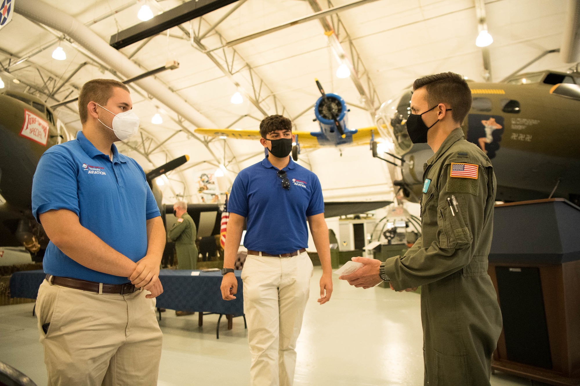 A group of Delaware State University students conversing with a Dover Air Force Base pilot.