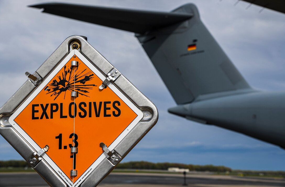 An explosive sign marks the cordon around a German air force A-400M Atlas during a foreign military sales mission at Dover Air Force Base, Delaware, April 19, 2021. As NATO allies, the United States and Germany work side by side to maintain and build peace and stability throughout Europe and the world. Dover AFB’s FMS mission supports approximately $3.5 billion worth of equipment annually. (U.S. Air Force photo by Airman 1st Class Stephani Barge)