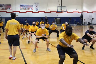 GREAT LAKES, Ill. (March 8, 2021) Training Support Center (TSC) Great Lakes Command Fitness Leaders (CFL) and fitness specialists implementing physical fitness efforts following pause due to COVID 19. Physical training will be conducted, adhering to virus mitigation rules, by CFL and TSC staff volunteers utilizing Navy Operational Fitness and Fueling Series (NOFFS) and authorized Navy Fitness routines.  (U.S. Navy photo by FCSA Elizabeth Jordan /Released)