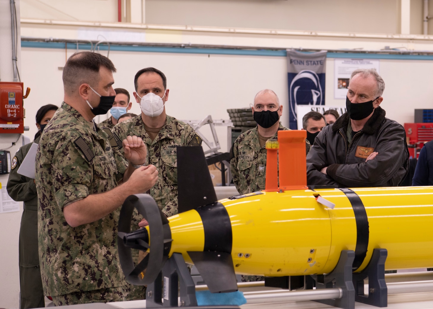 Cmdr. Rob Patchin, commanding officer of Unmanned Undersea Vehicle Squadron  (UUVRON) 1, explains the capabilities of a Razorback unmanned undersea vehicle to Capt. Lincoln Reifsteck.