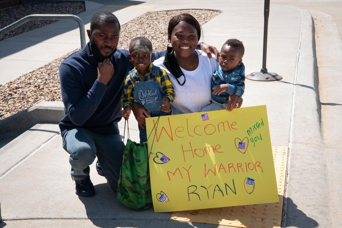 Staff Sgt. Bernice Asiedu, a 28th Comptroller Squadron financial analyst non-commissioned officer in charge, welcomes her family home from their mock deployment during an event on Ellsworth Air Force Base, S.D., April 17, 2021.