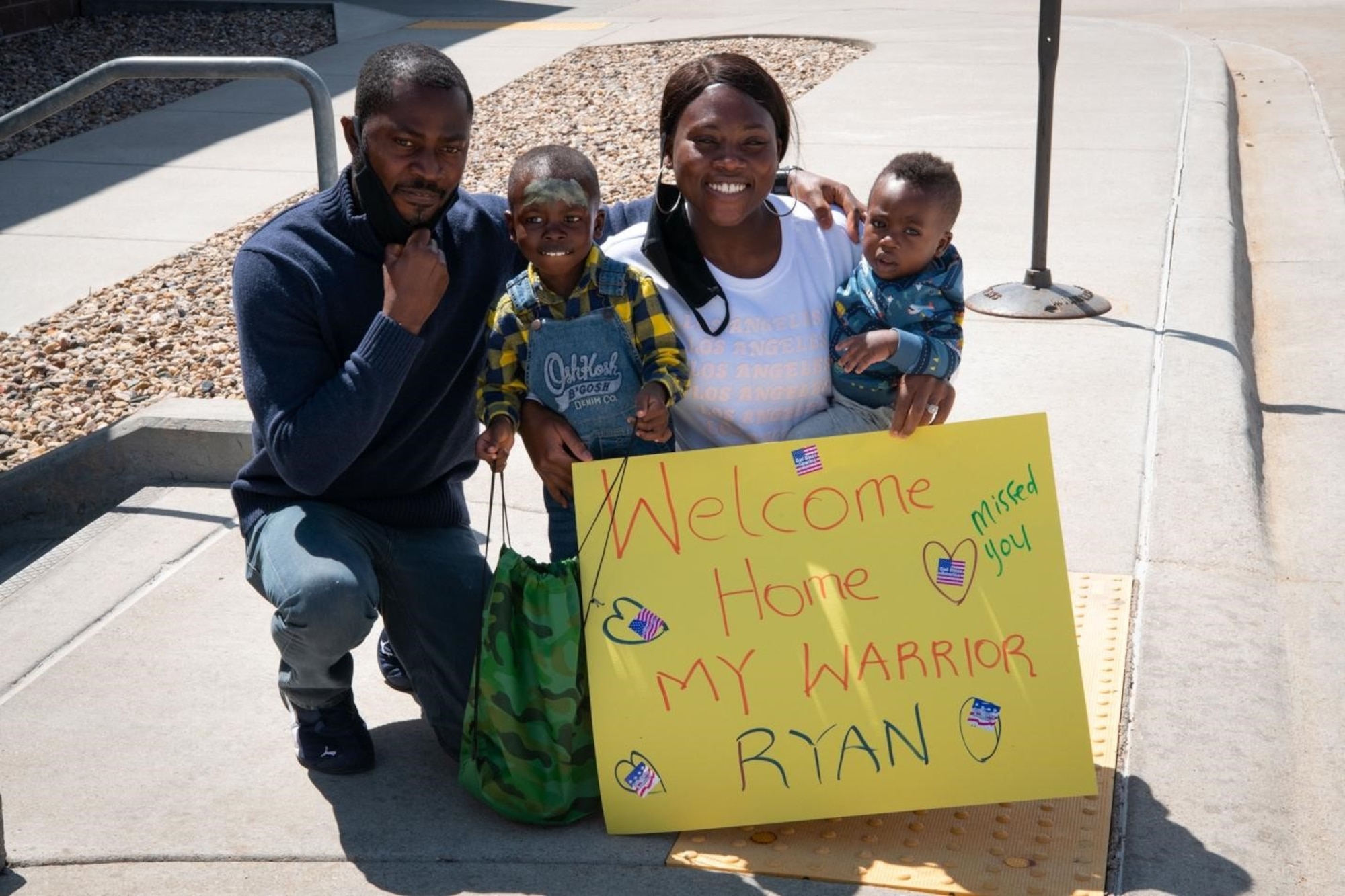 Staff Sgt. Bernice Asiedu, a 28th Comptroller Squadron financial analyst non-commissioned officer in charge, welcomes her family home from their mock deployment during an event on Ellsworth Air Force Base, S.D., April 17, 2021.