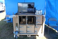 Carderock’s Charging-Capable Li-ion Autonomous Safe Storage Interservice Container demonstration station at the 2021 Naval Integration in Contested Environments Advanced Naval Technology Exercise on April 12 in Camp Lejeune, N.C.
